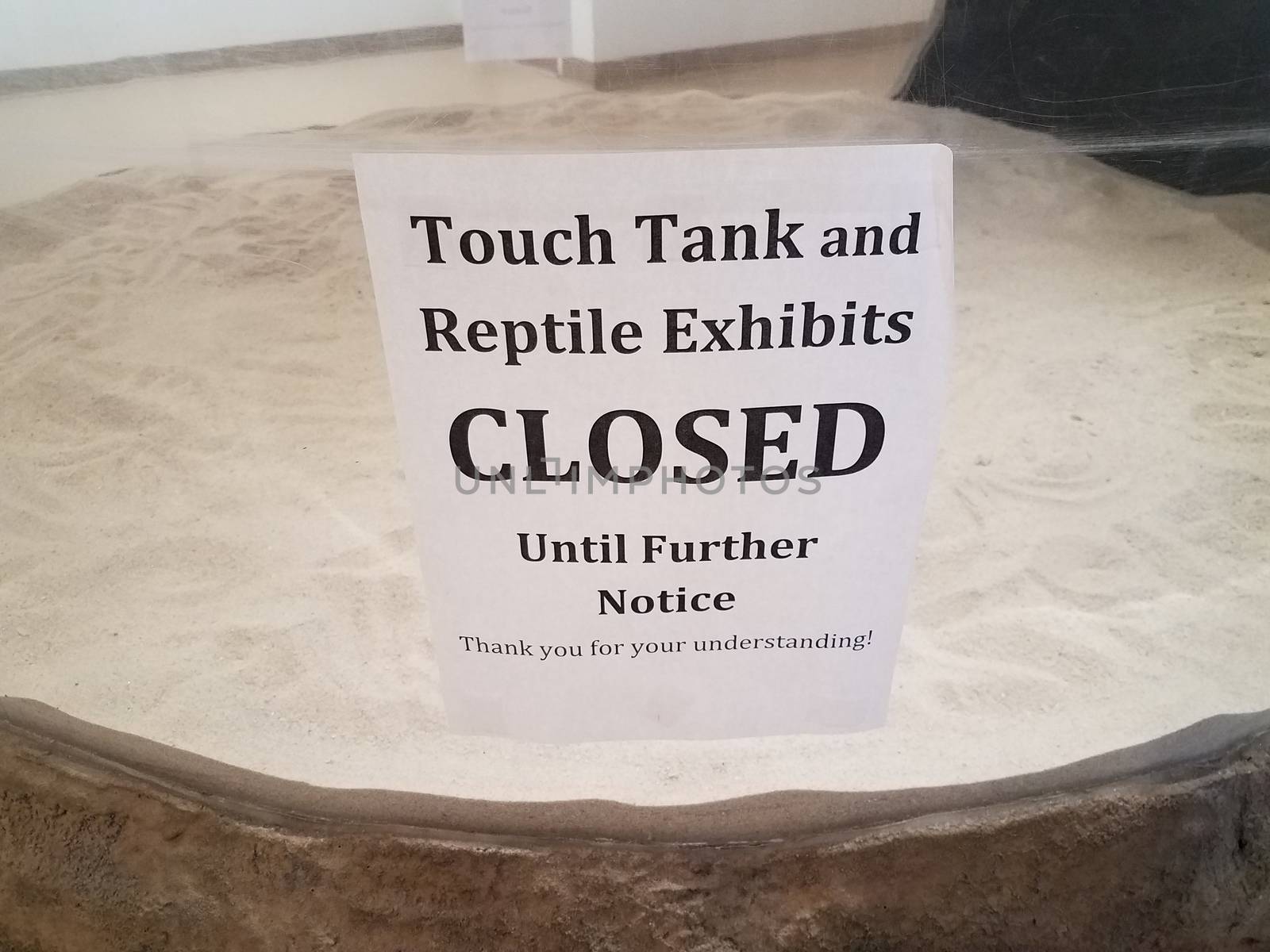 touch tank closed sign with glass and sand by stockphotofan1