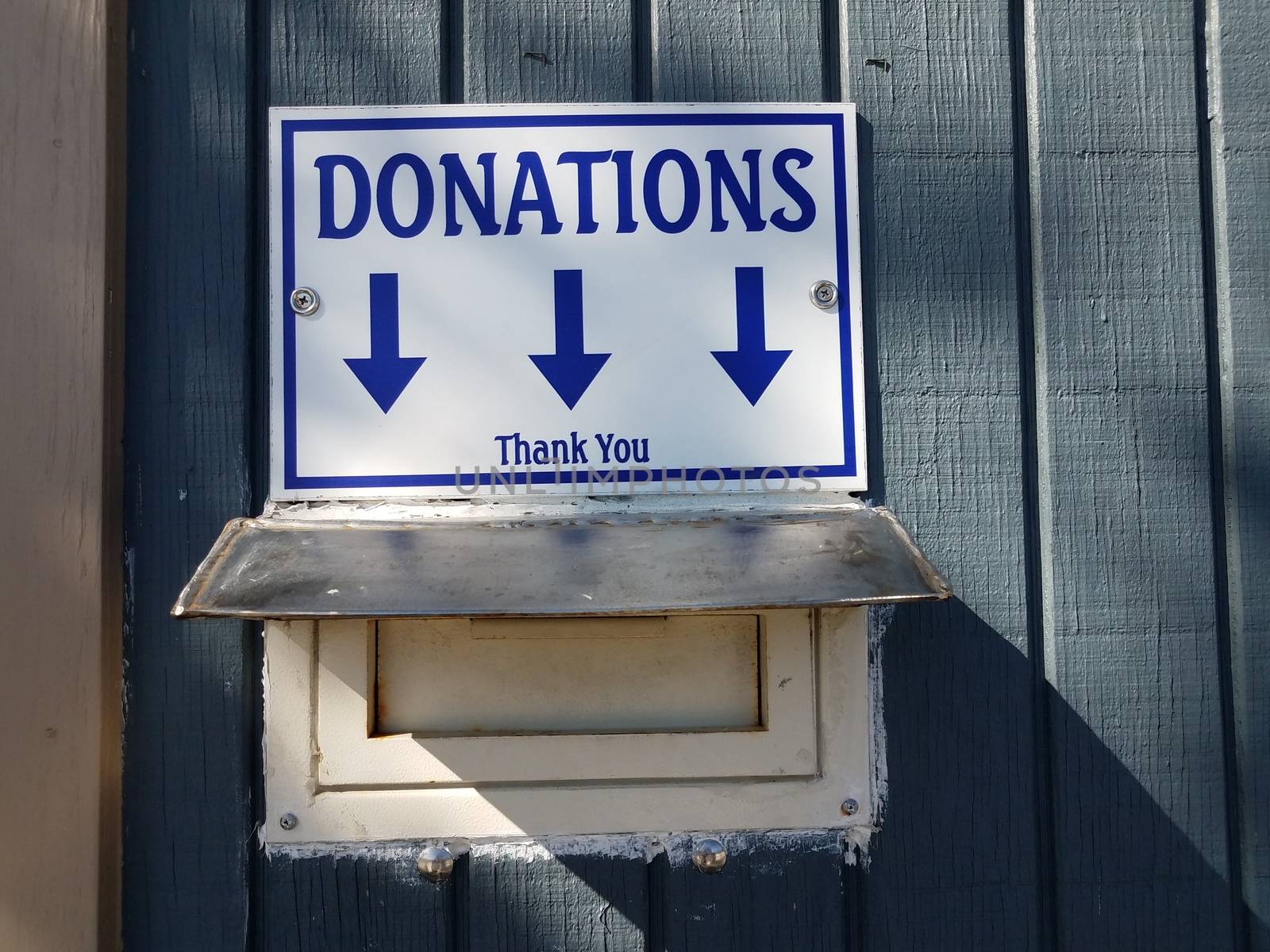 donations sign with slot and arrows and thank you by stockphotofan1