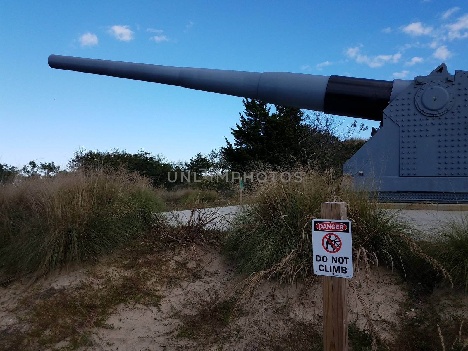 large metal artillery gun and danger sign in Lewes, Delaware by stockphotofan1