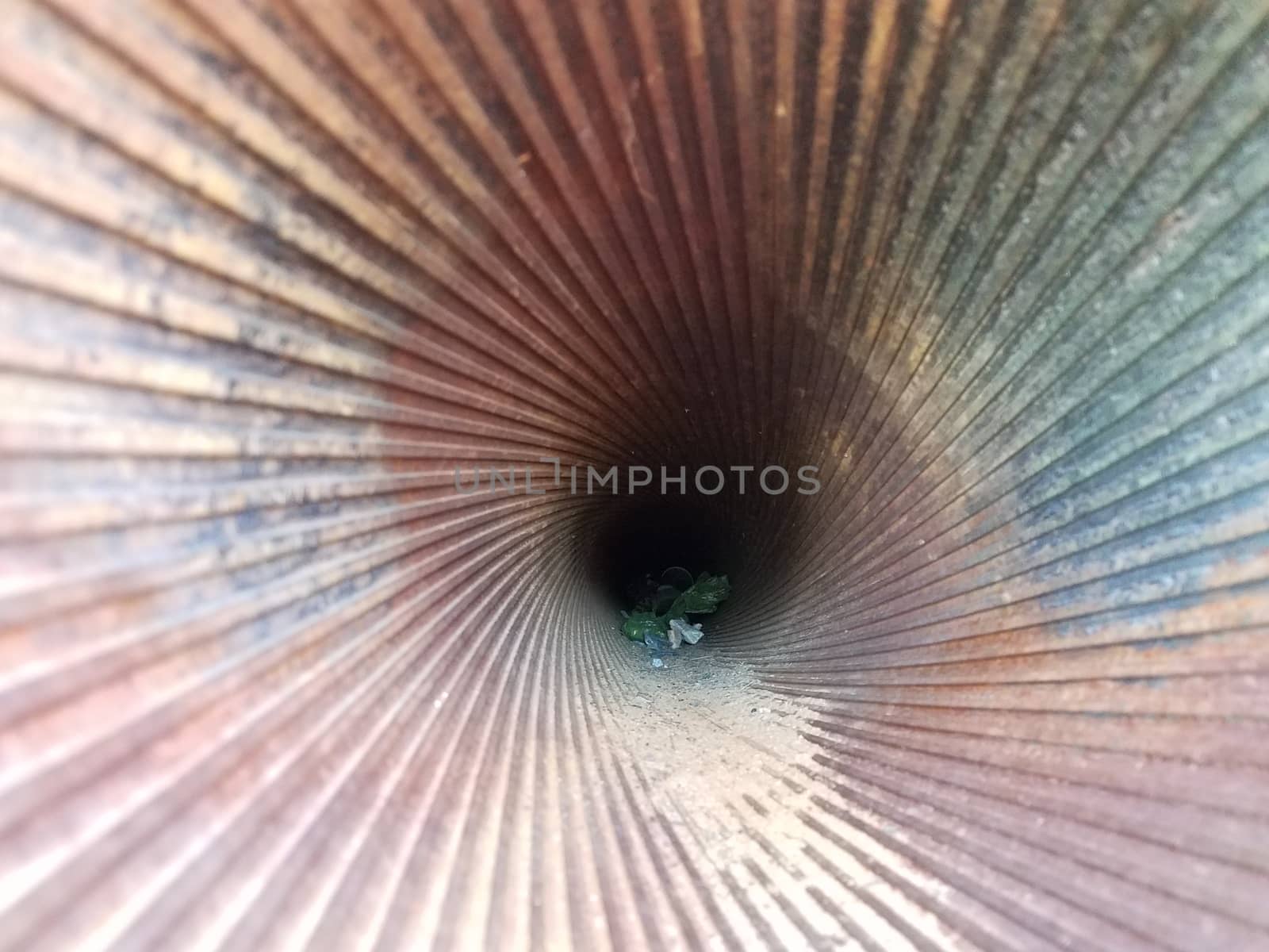 grooves inside metal gun with sand and trash by stockphotofan1