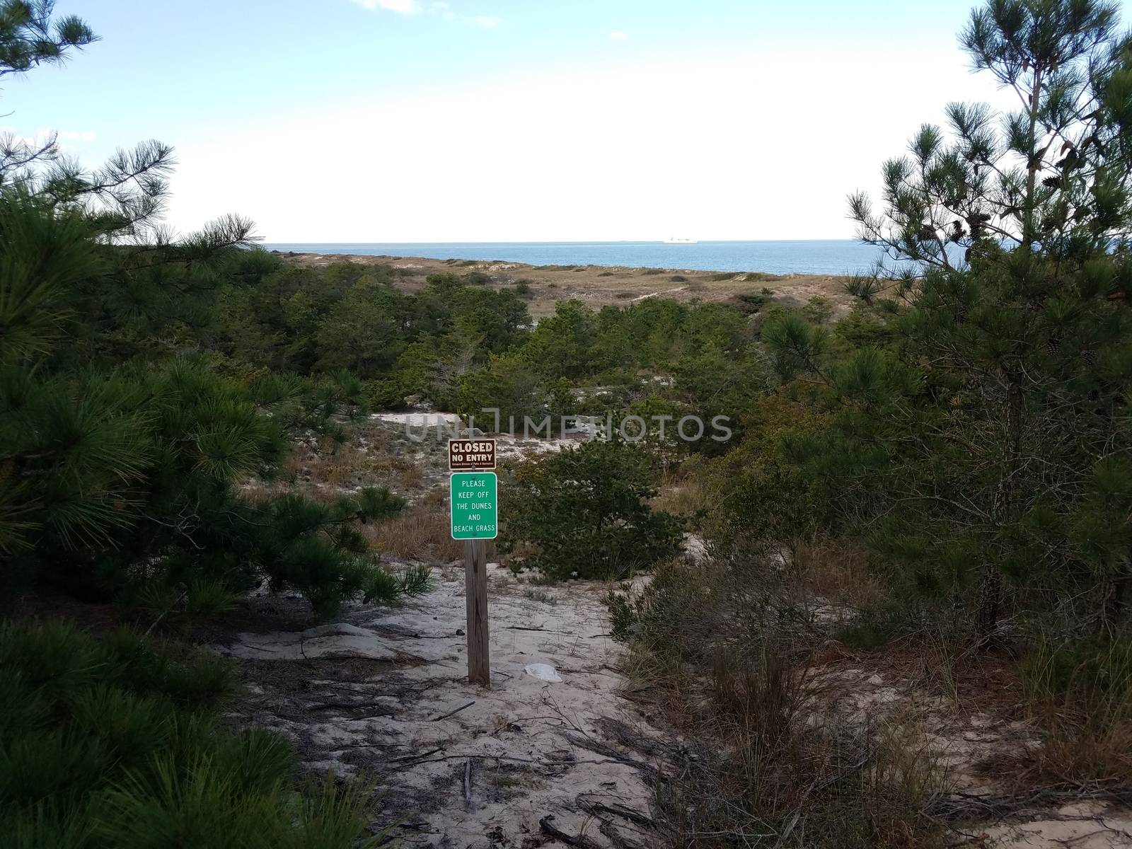 closed no entry please keep off dunes sign in Delaware by stockphotofan1