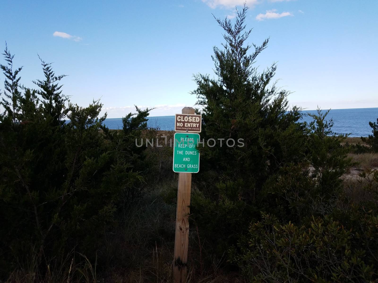 closed no entry please keep off dunes sign in Delaware by stockphotofan1