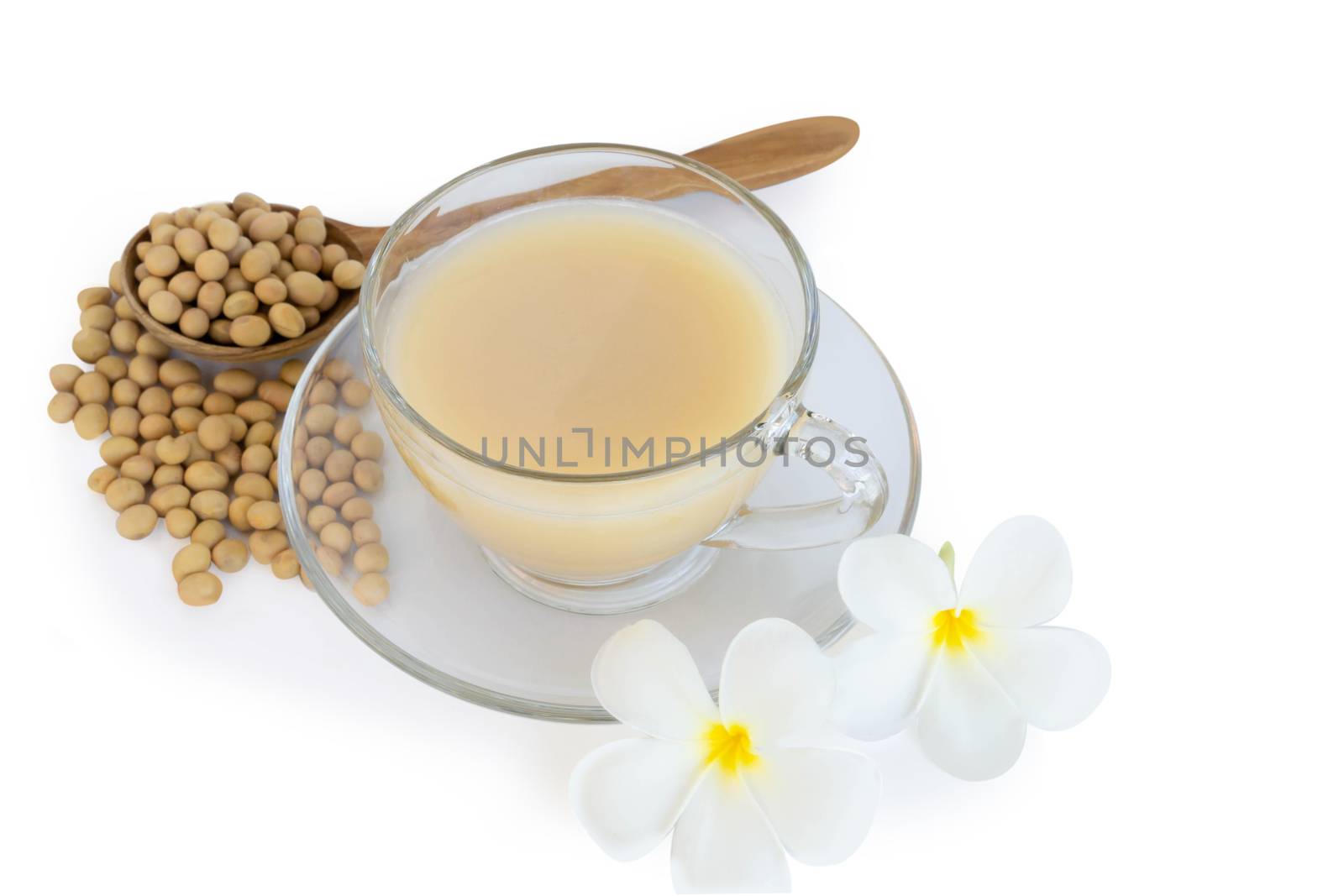Soymilk in glass with soy beans in wooden spoon isolated on whit by pt.pongsak@gmail.com