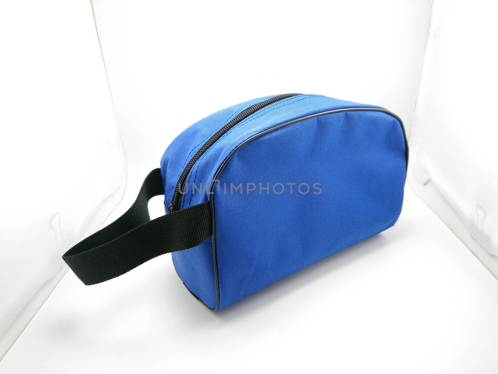 Blue portable hand bag with sling use to put stuffs inside