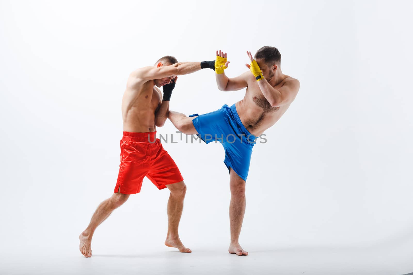 Two men boxers fighting muay thai boxing white background.