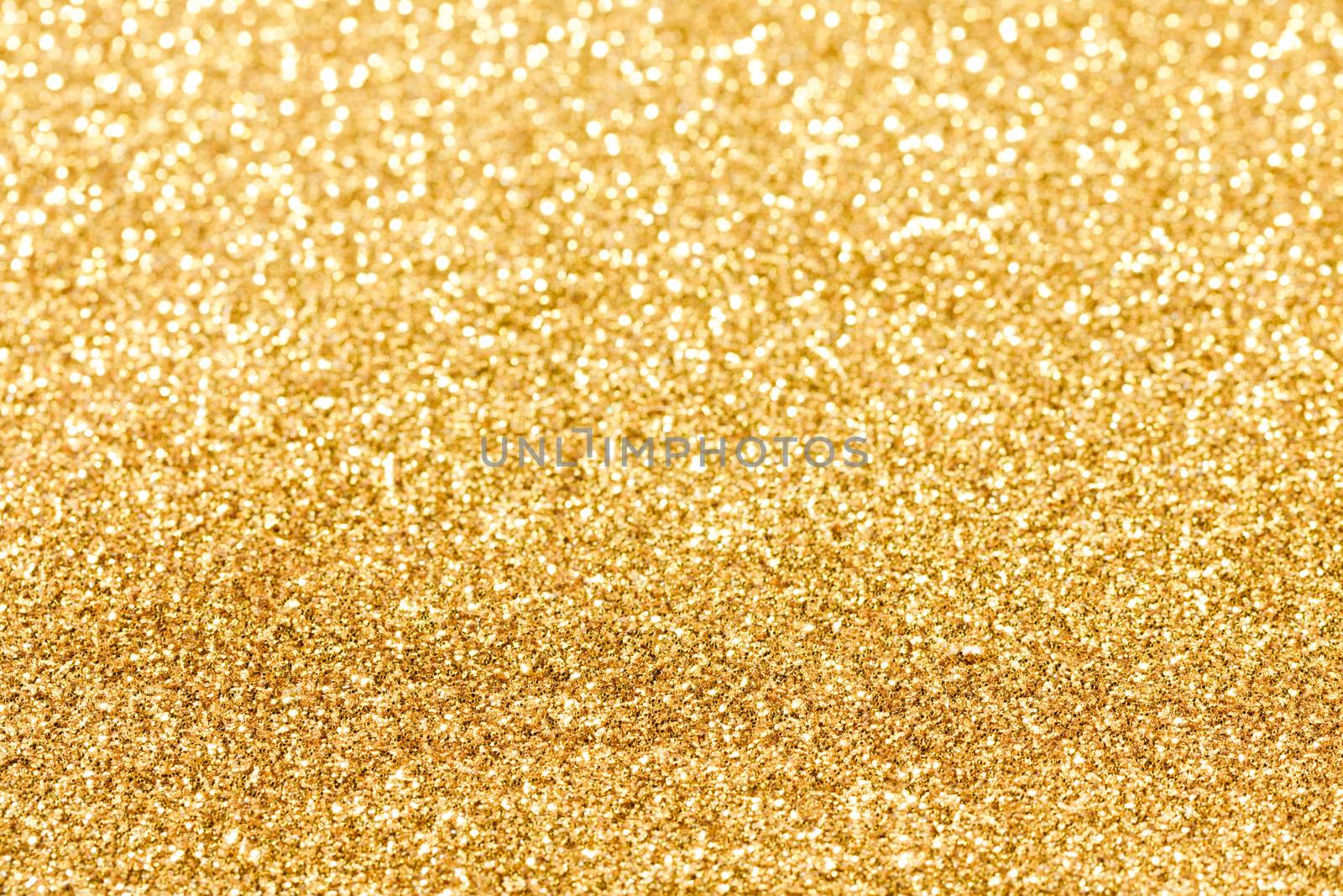 Shiny golden bokeh glitter lights abstract background, Christmas New Year party celebration concept