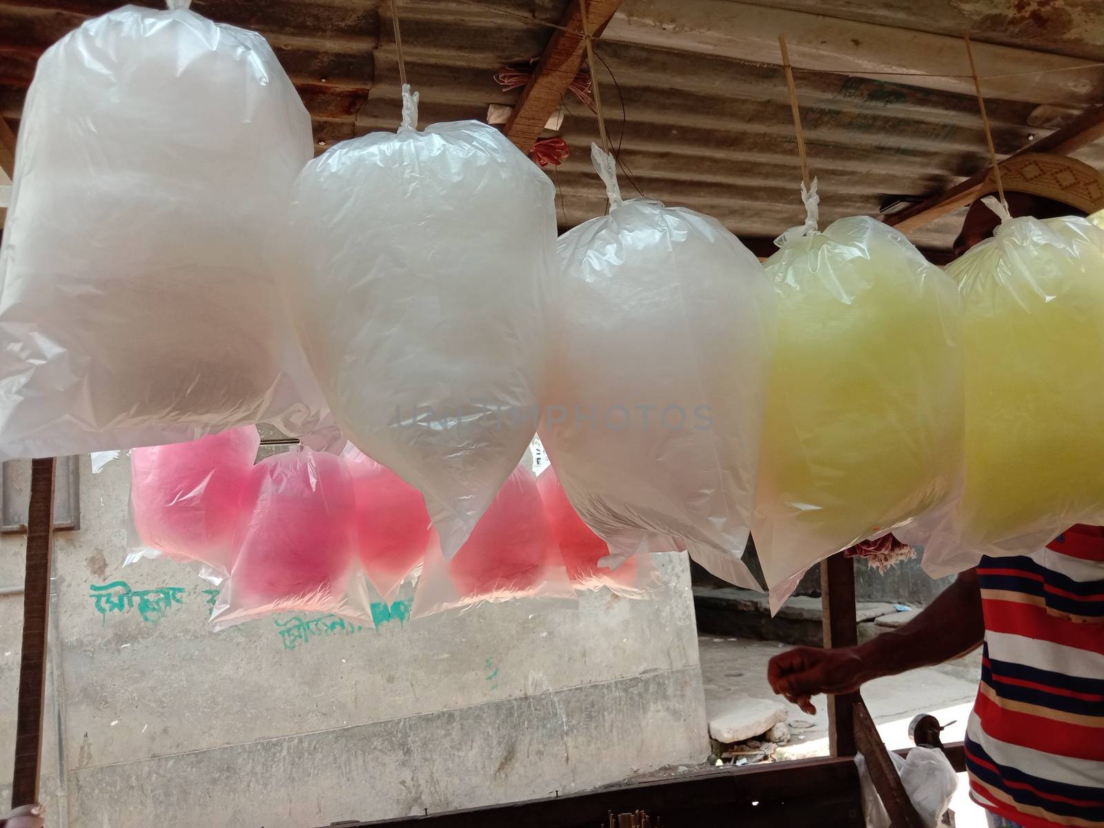 tasty and healthy pink and white and yellow colored cotton candy