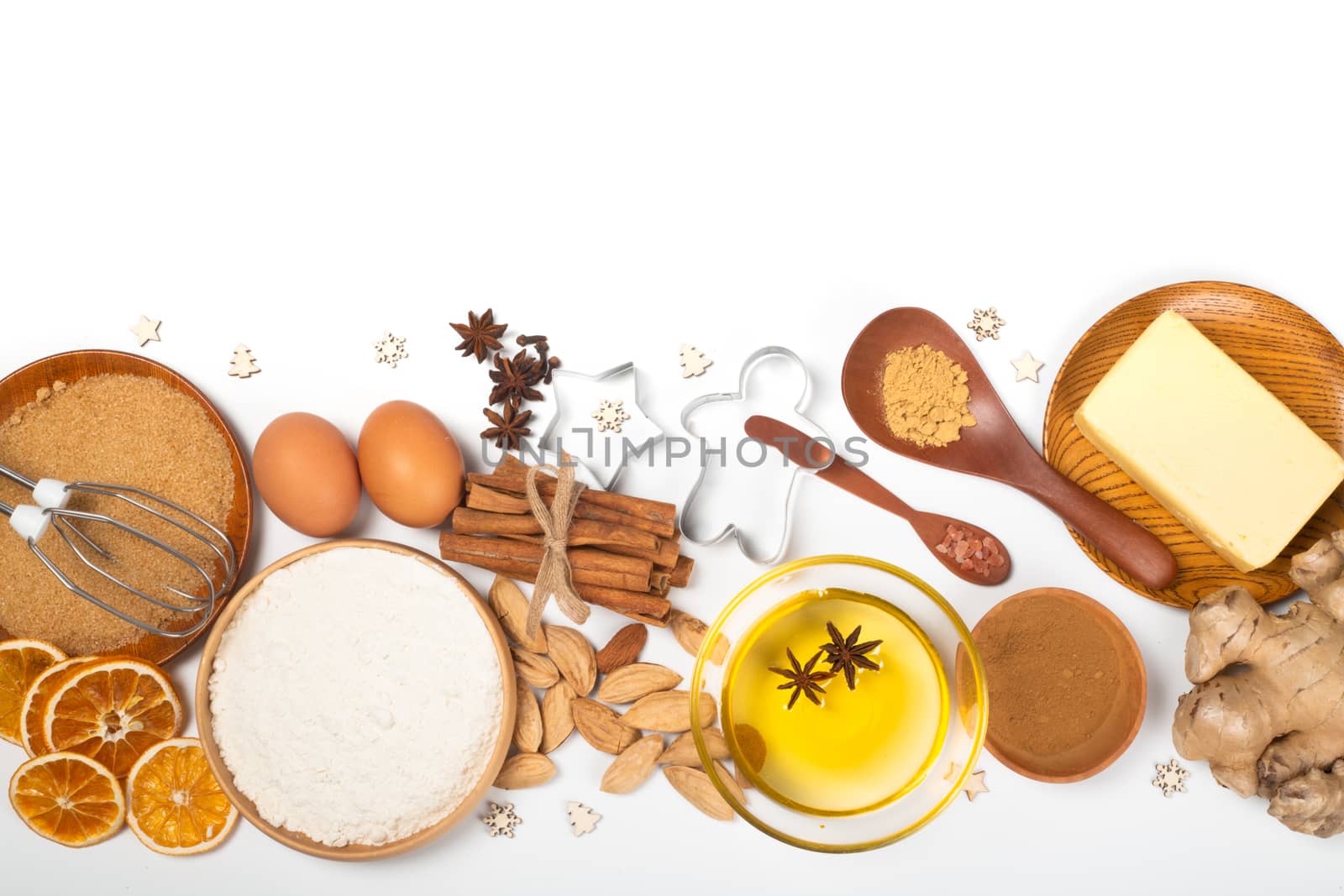 Christmas gingerbread cookies cooking background flat lay top view template with copy space for text. Baking utensils, spices and food ingredients isolated on white background