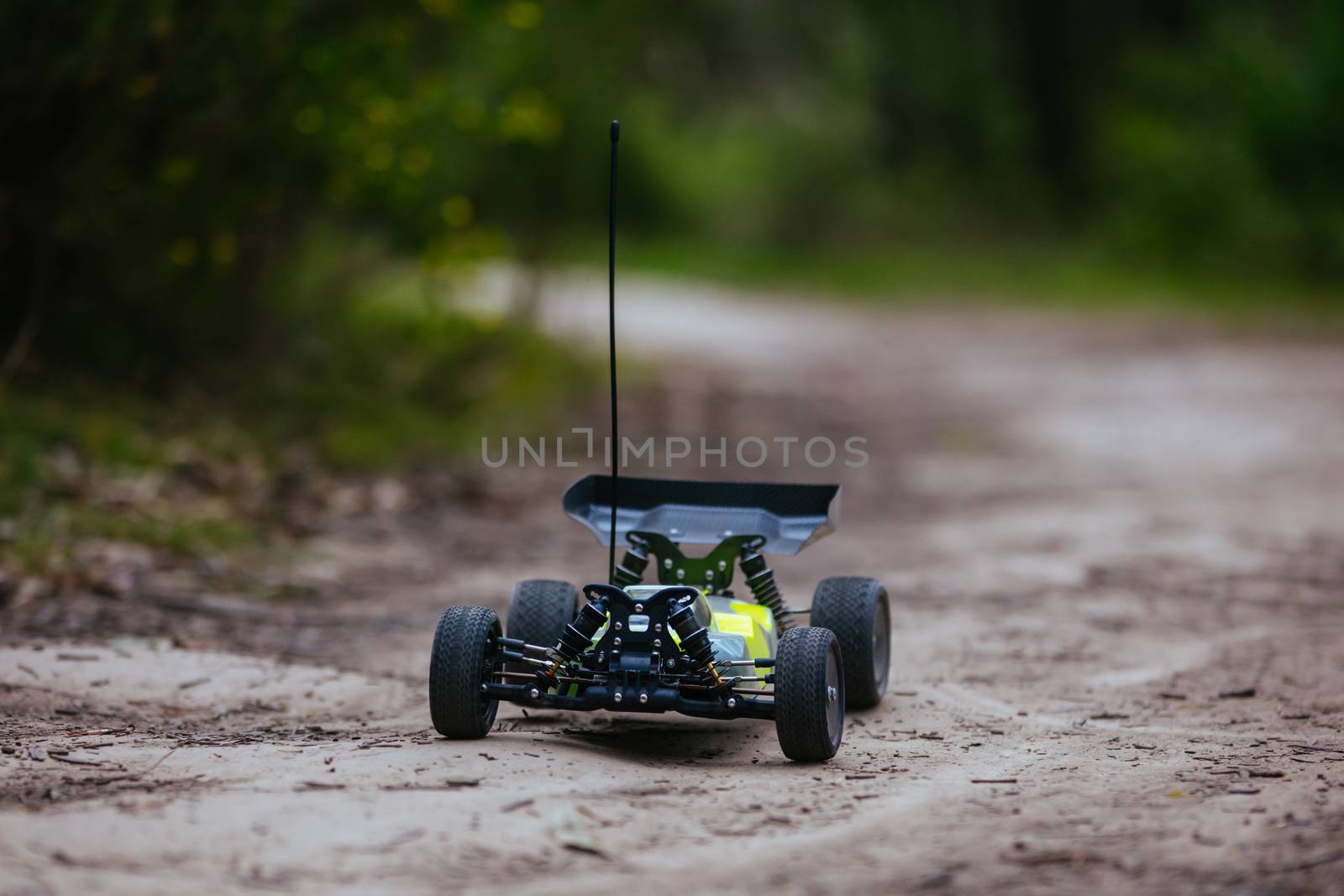 An offroad radio controlled car in action in rural bushland in Victoria, Australia