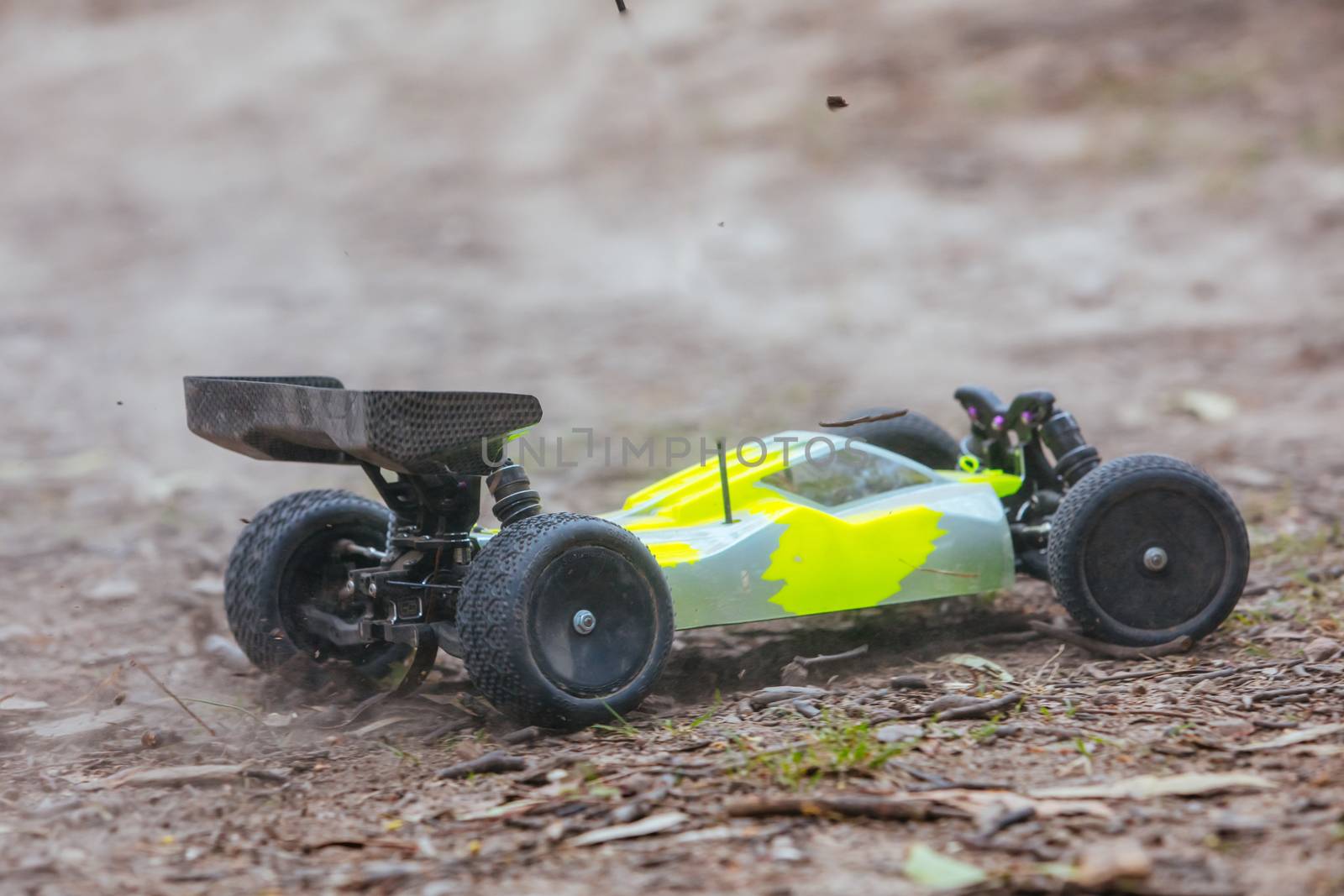 An offroad radio controlled car in action in rural bushland in Victoria, Australia