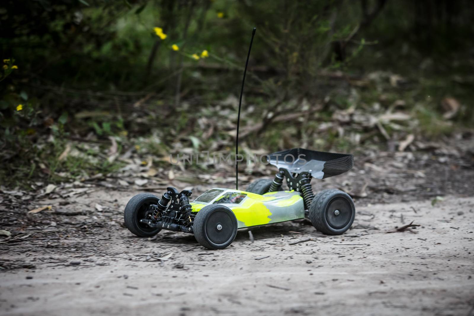 An offroad radio controlled car in action in rural bushland in Victoria, Australia
