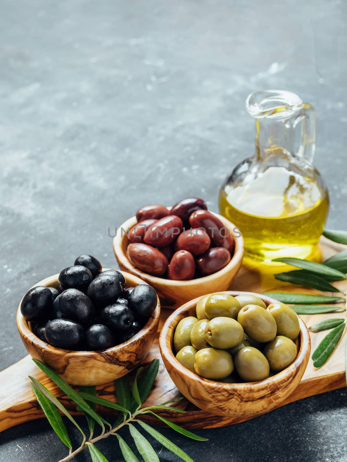 Set of different types olives and olive oil by fascinadora