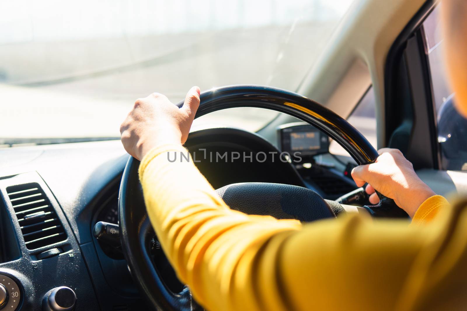 woman while driving the car by Sorapop