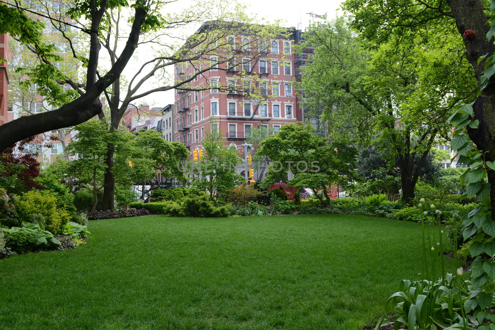 Verdant lawn and flower beds in the peaceful Jefferson Market Garden in Greenwich Village, New York City