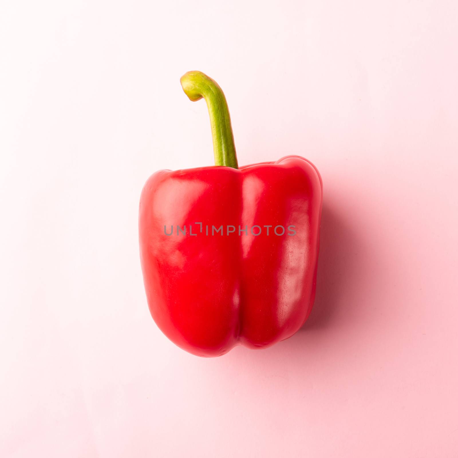 Close up above top view of raw red bell peppers on pink pastel background, fresh organic vegetables, Healthy lifestyle diet food concept