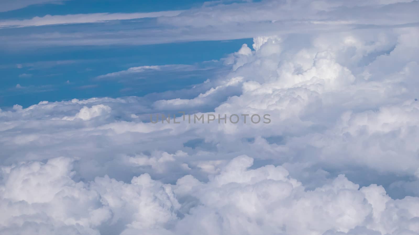 The cloudscape of beautiful cloud in the sky background view from airplane.