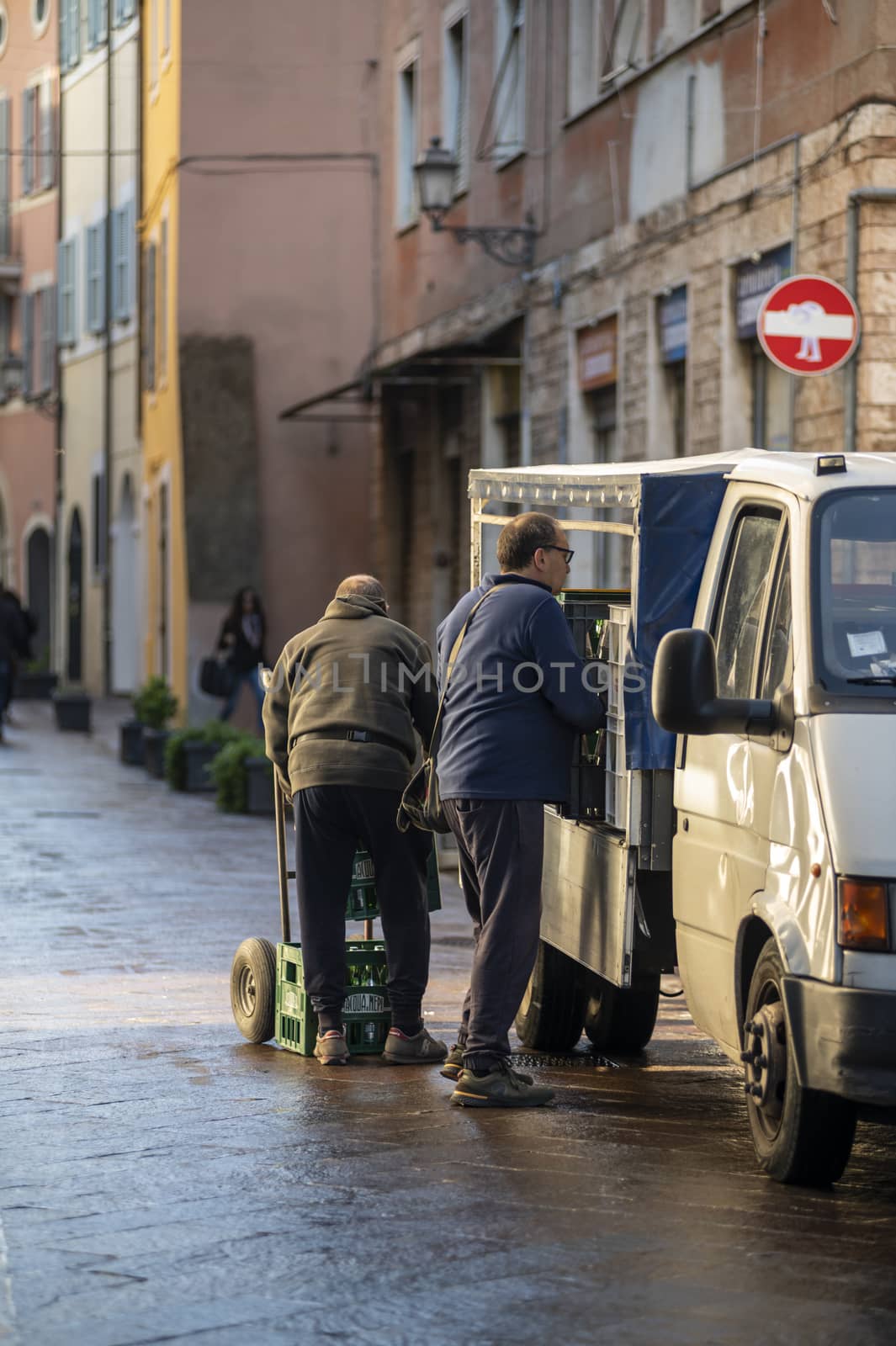 terni,itali october 05 2020:men unloading drinks into a van