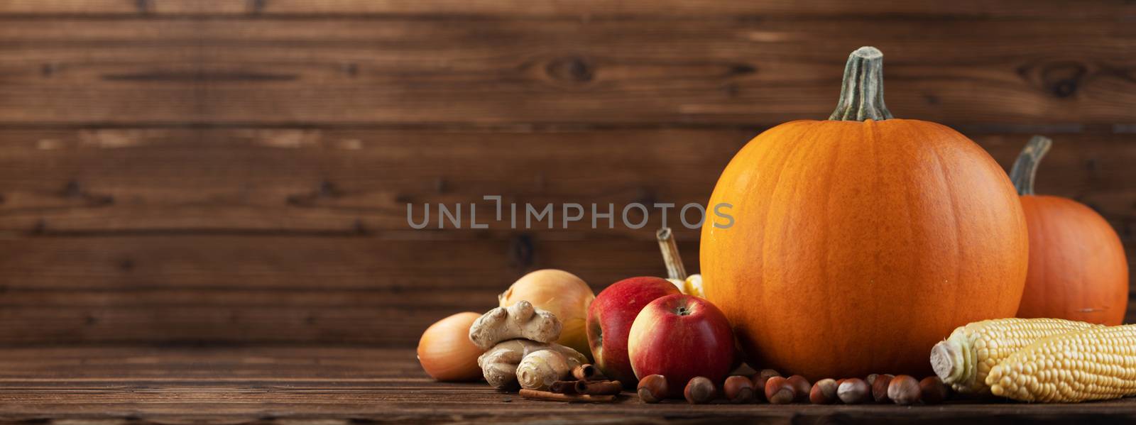 Autumn harvest on wooden table by Yellowj