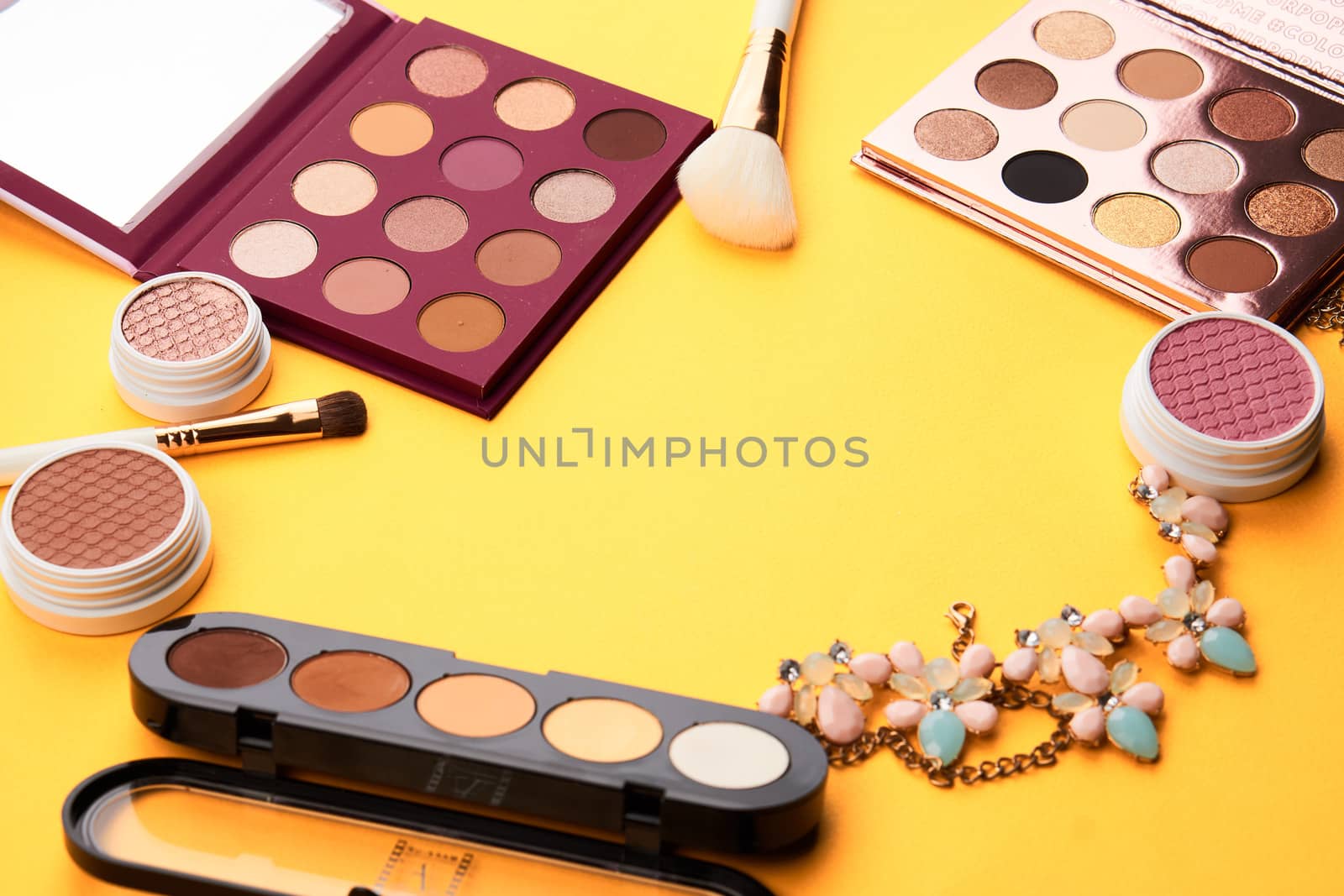 Professional cosmetics palette with eyeshadow makeup brushes cropped look. High quality photo