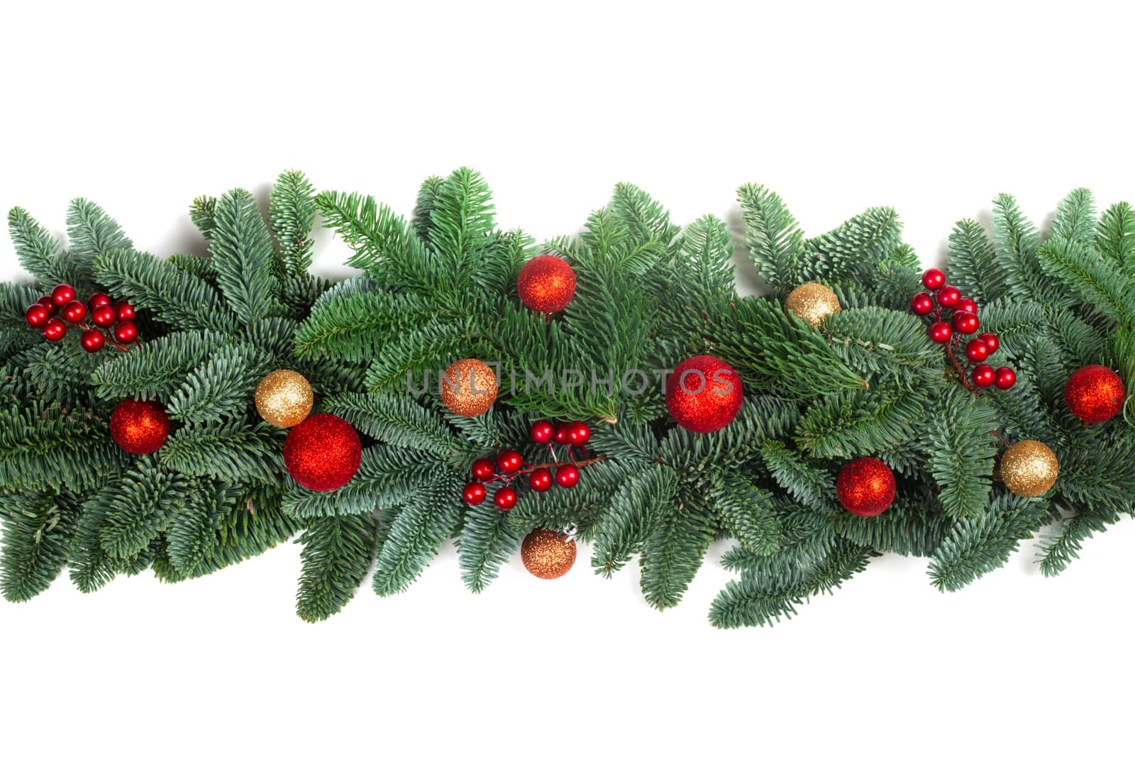 Christmas Border frame of natural noble fir tree branches red and golden baubles isolated on white background