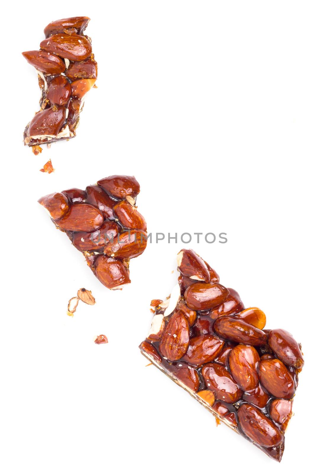 Nougat with almonds. Typical Sicilian dessert. Isolated on white background.