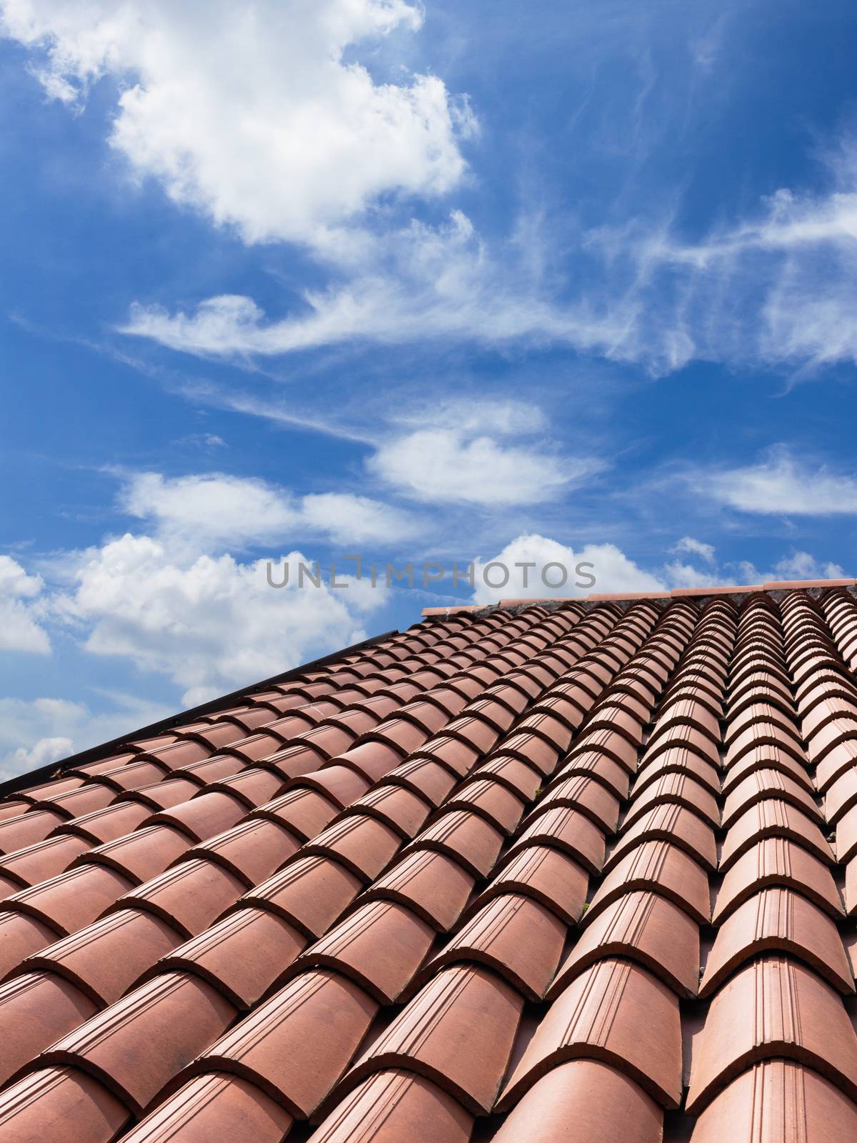 New tiled roof. Vertical view of a tiled roof brown.