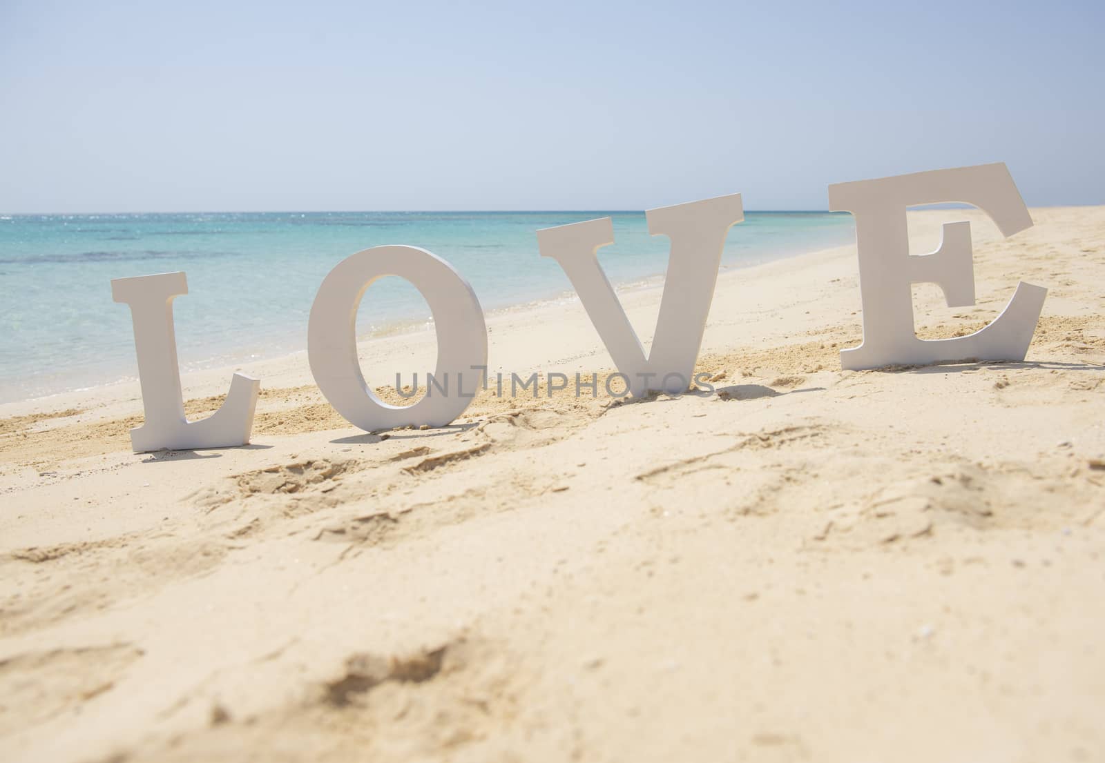Romantic sign on a tropical beach paradise by paulvinten