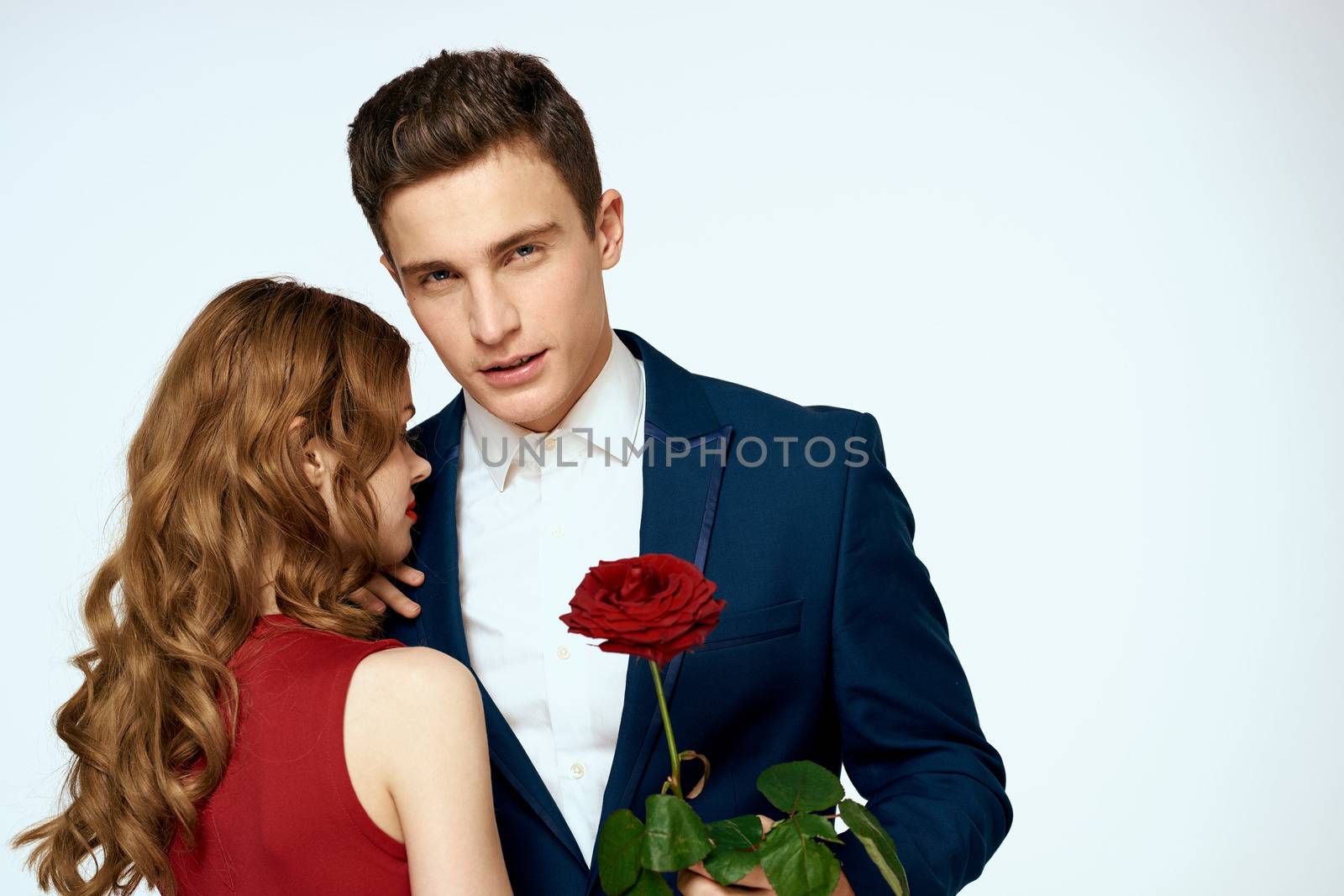 Beautiful couple charm relationship romance roses luxury love light background. High quality photo
