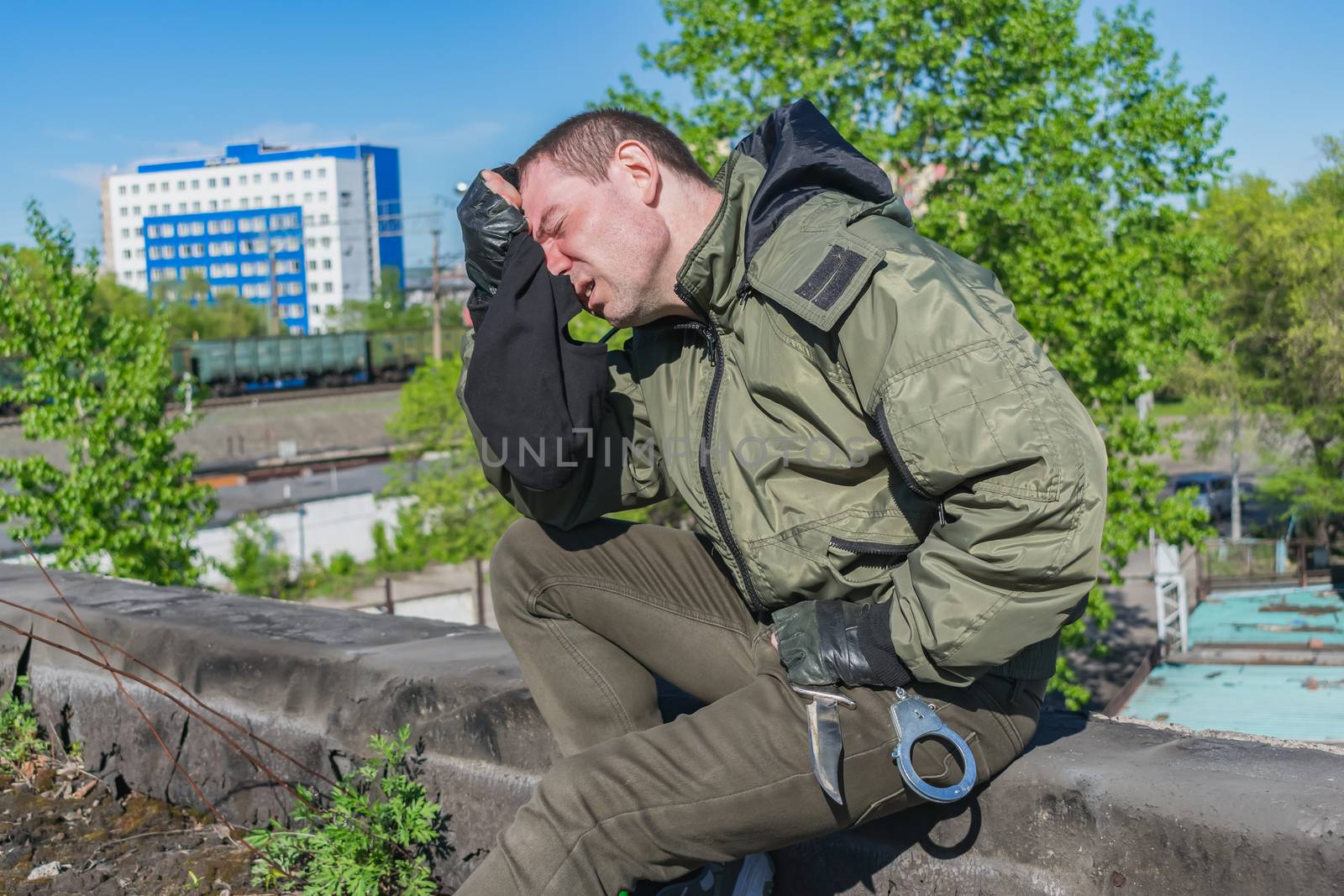 The soldier, tired after the fighting, sat down on the bardyur to rest