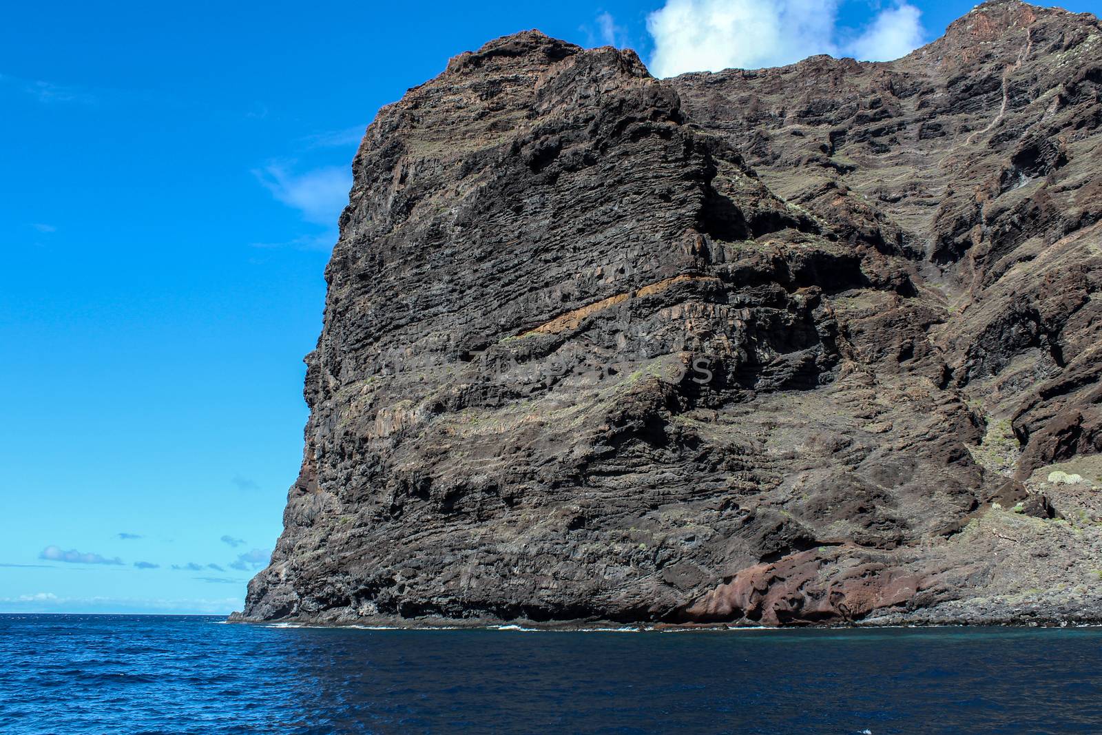 View on the steep coast of Los Gigantes on canary island tenerife with rocks in different colors