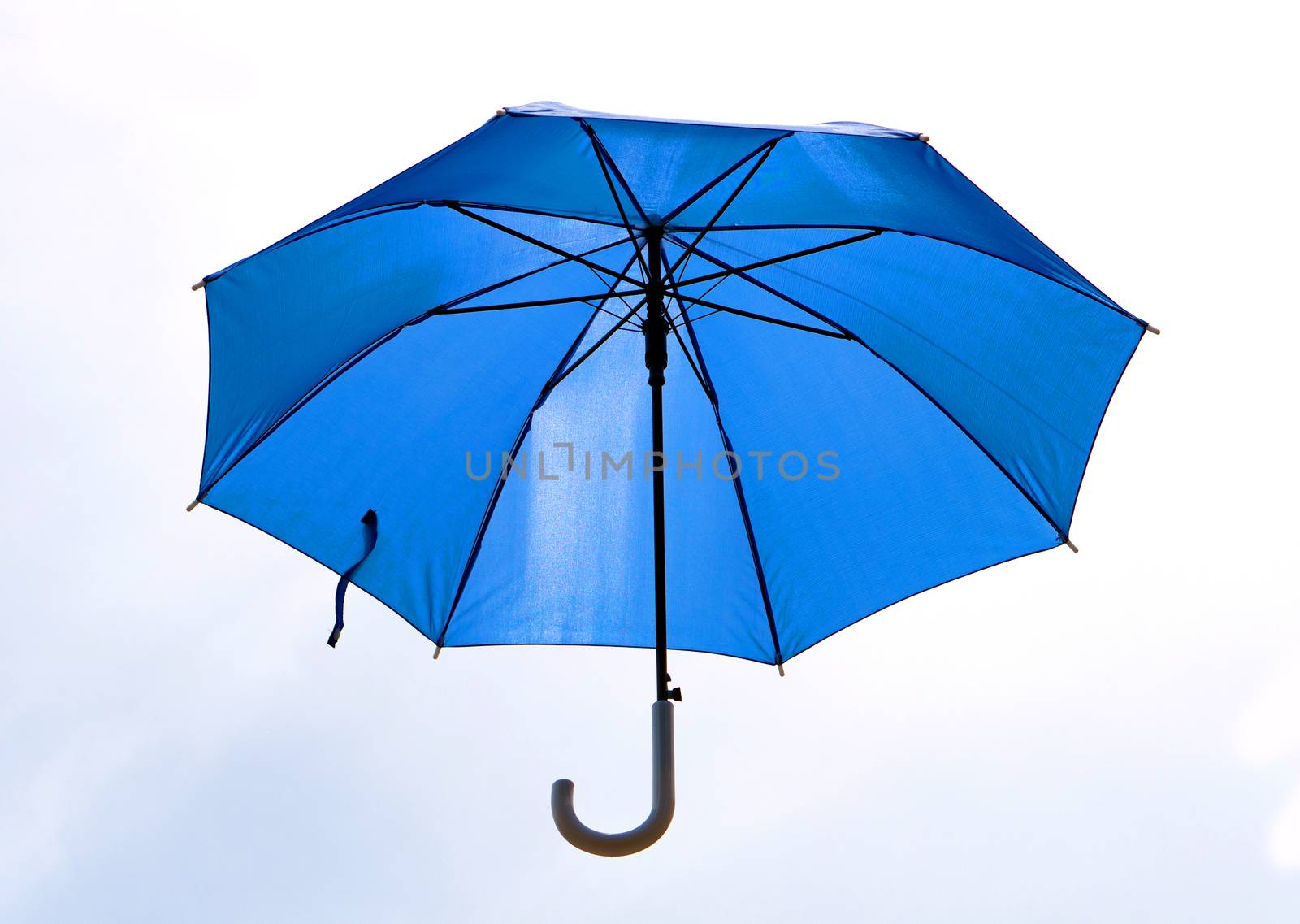 A blue umbrella that was unfolded isolated on white background.