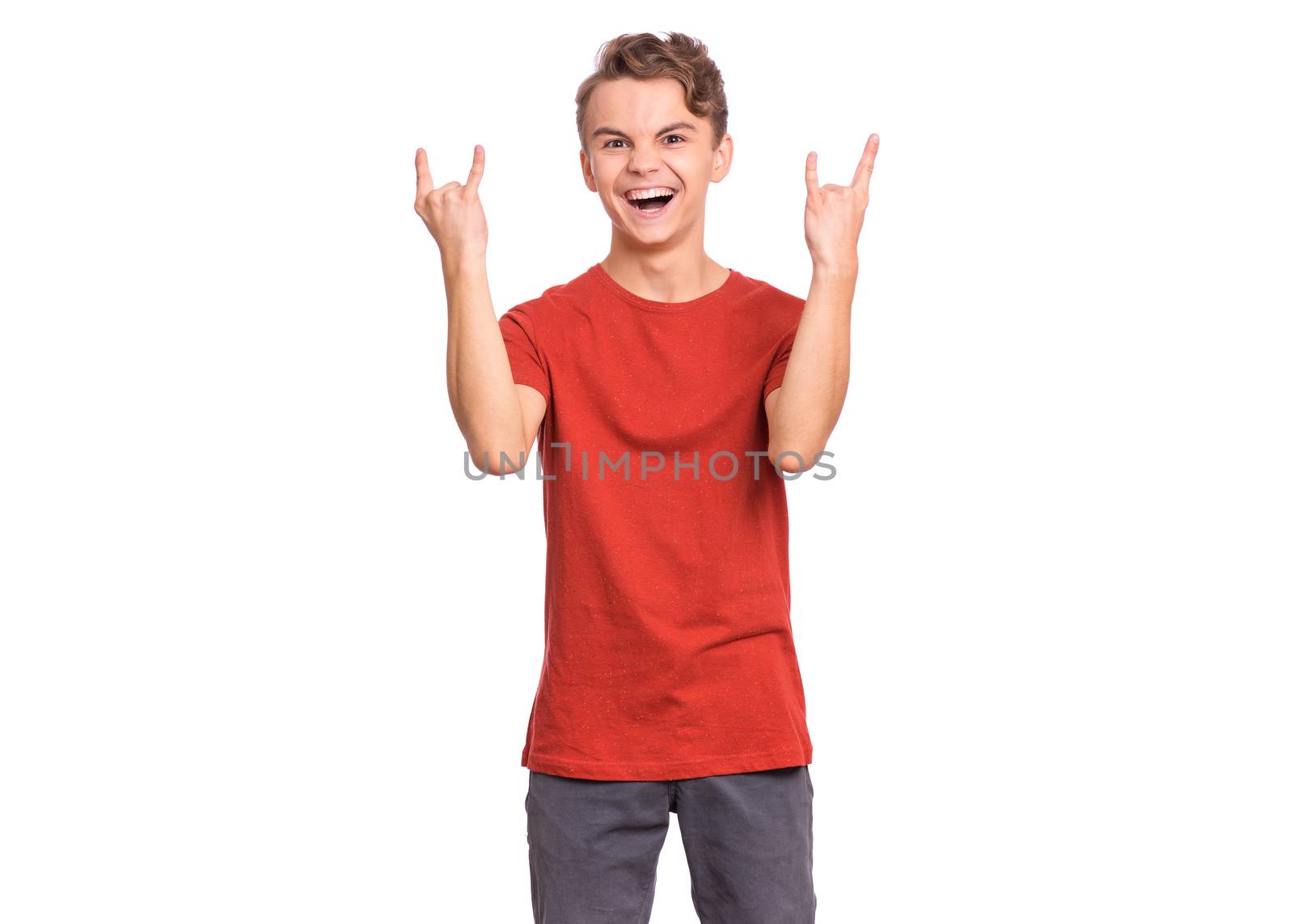 Handsome teen boy laughing looking very happy, isolated on white background.