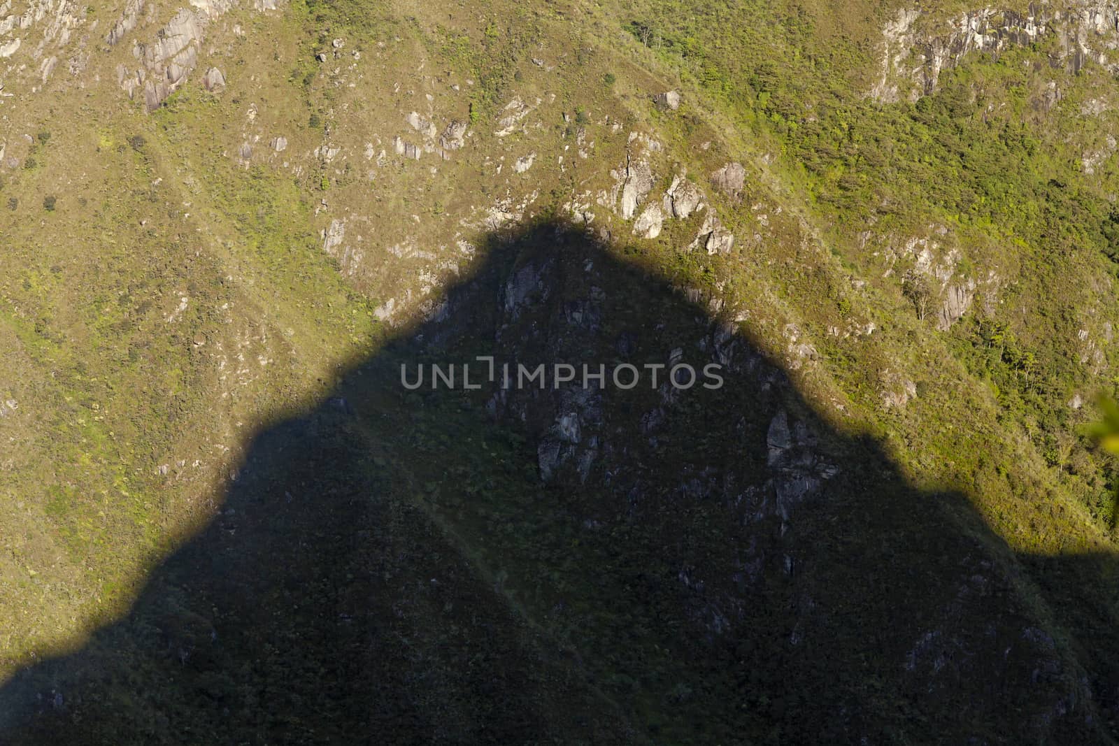 The silhouette shadow of the sacred mountain Huayna Picchu, Peru by alvarobueno