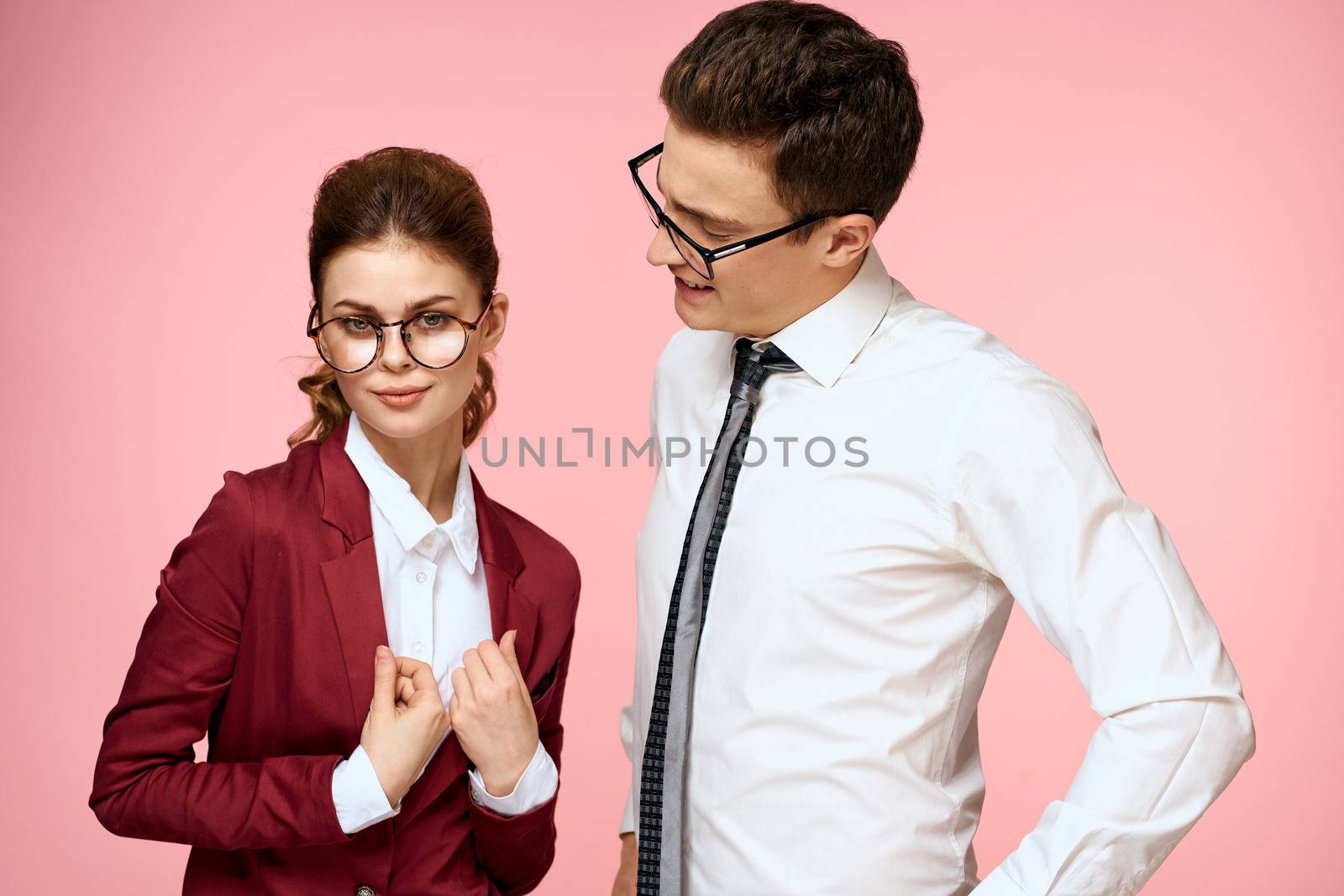 business man and woman office work colleagues team office management studio pink background. High quality photo