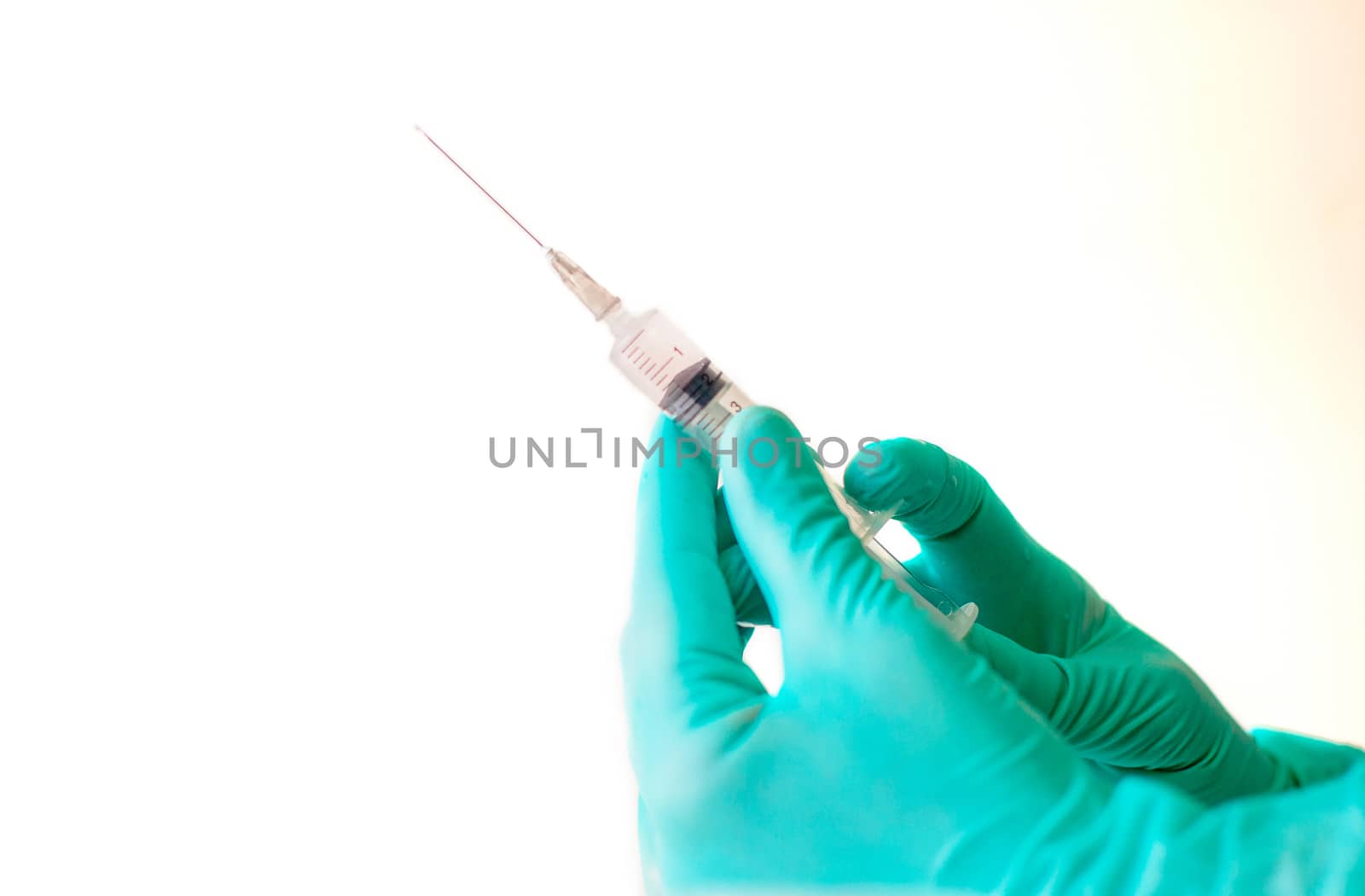 nurse hands in blue latex gloves holding an injection syringe isolate. The concept of health and vaccination. Copy space by Alla_Morozova93