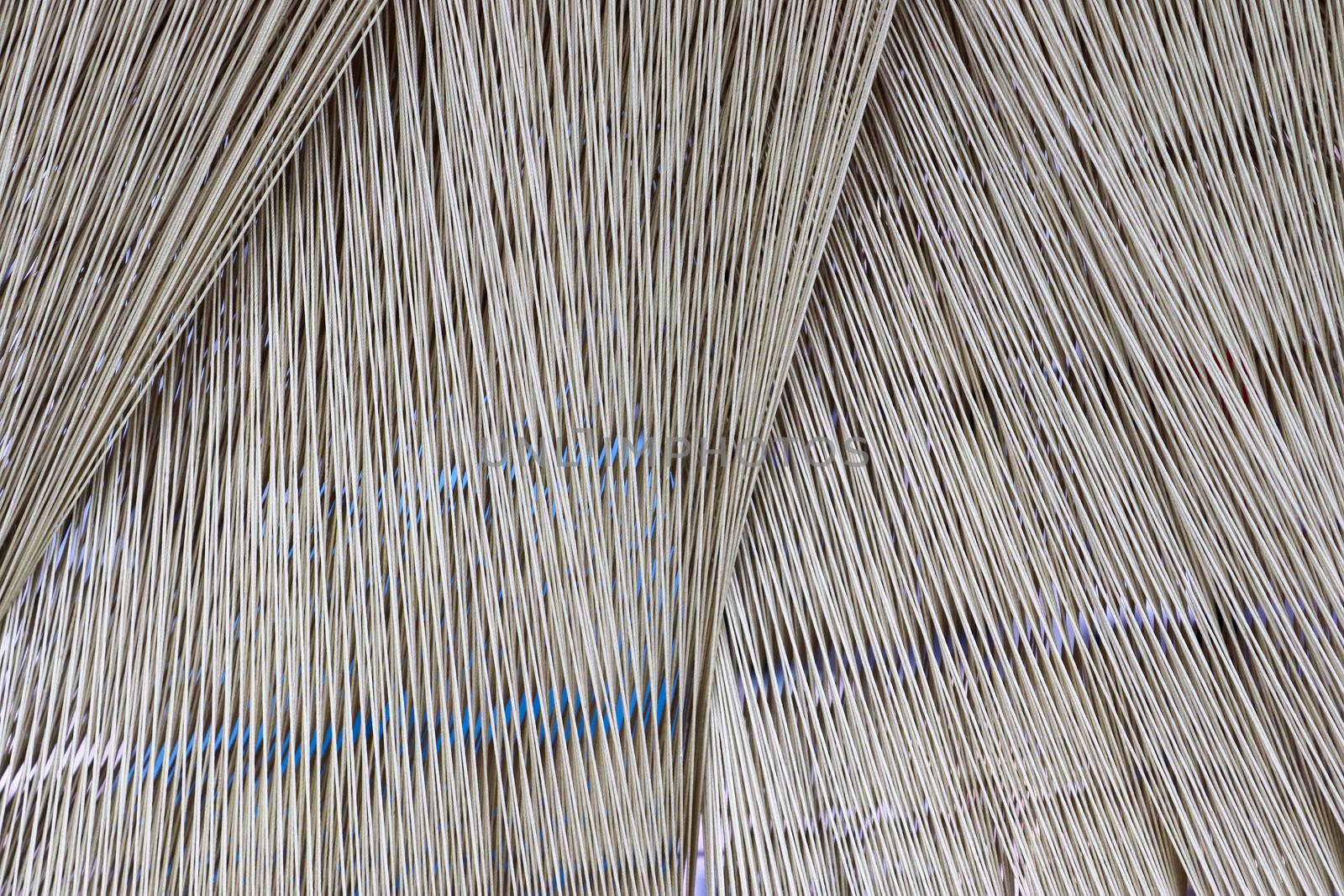 Close up texture of a lot of threads in a weaving machine called by MP_foto71