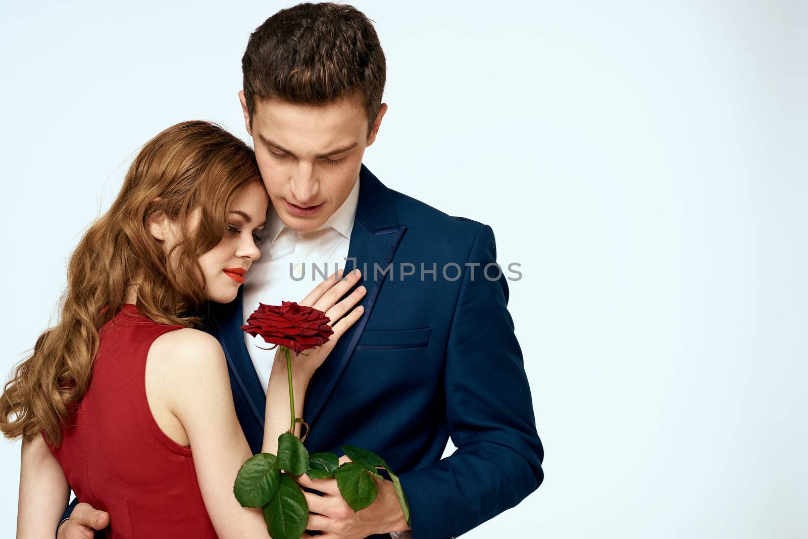 Beautiful couple charm relationship romance roses luxury love light background. High quality photo