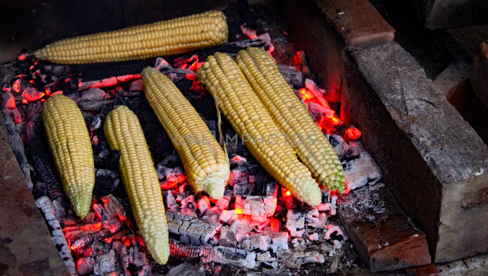 Six corn on the cob grilled in the traditional way. Grilled corn. by mahirrov