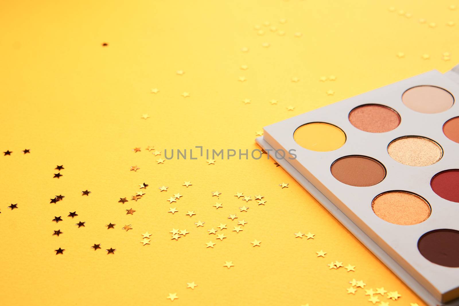 eyeshadow makeup brushes collection professional cosmetics on yellow background. High quality photo