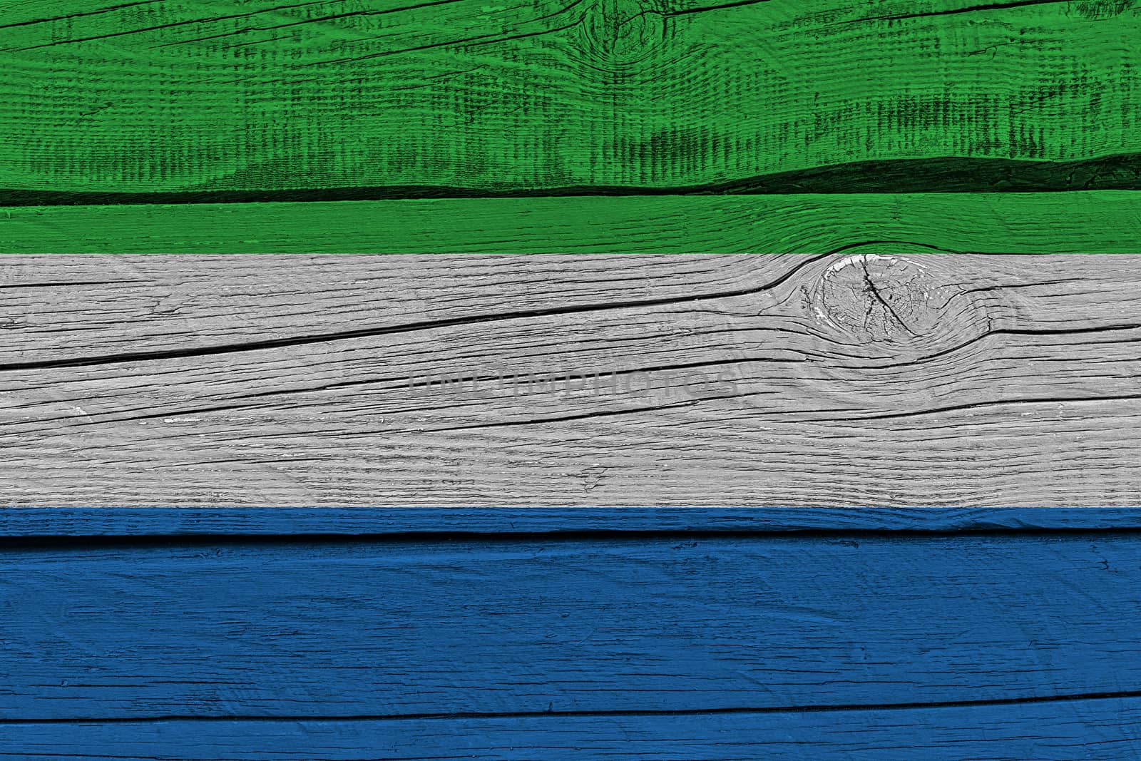 Sierra leone flag painted on old wood plank. Patriotic background. National flag of Sierra leone