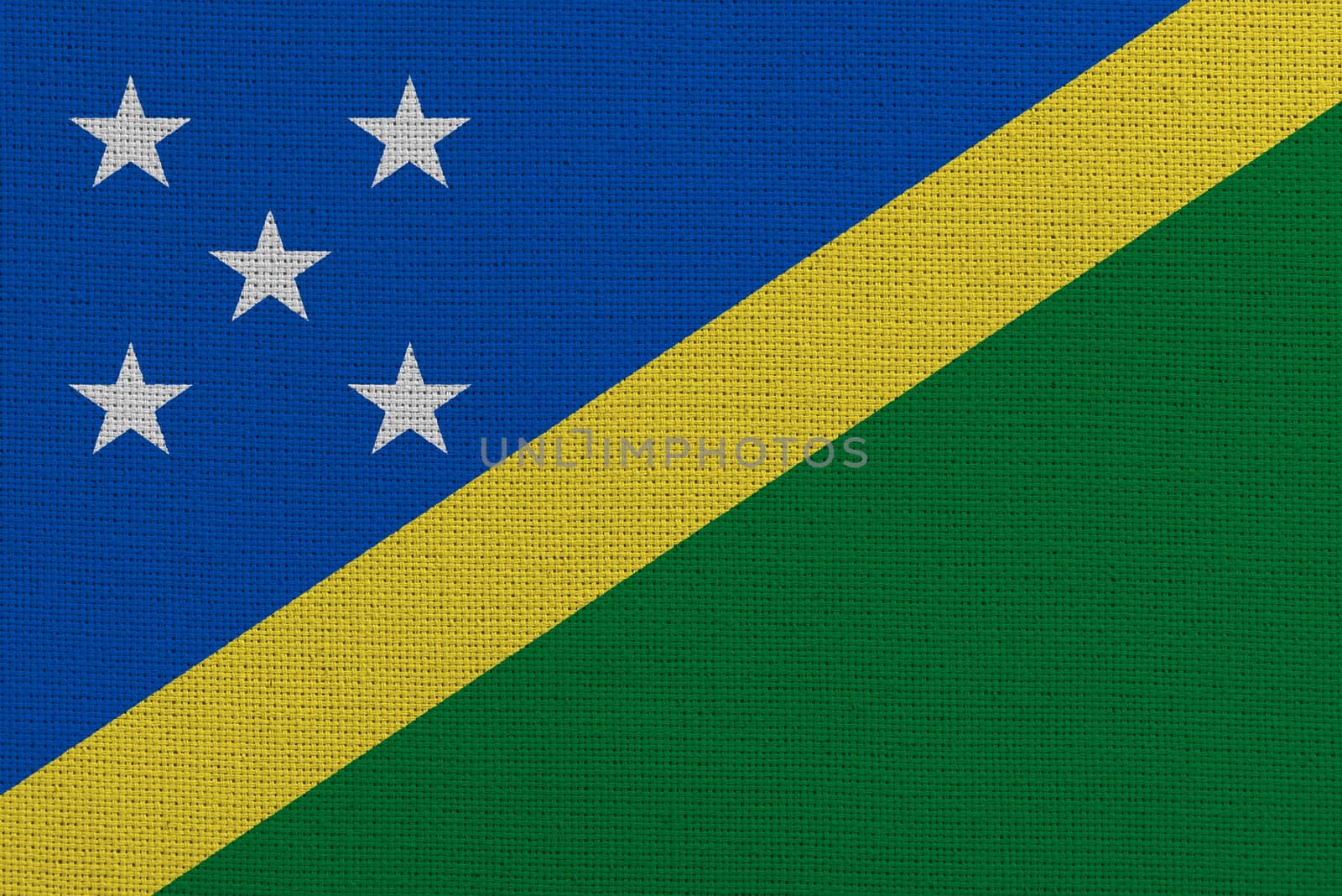 Solomon Islands fabric flag. Patriotic background. National flag of Solomon Islands