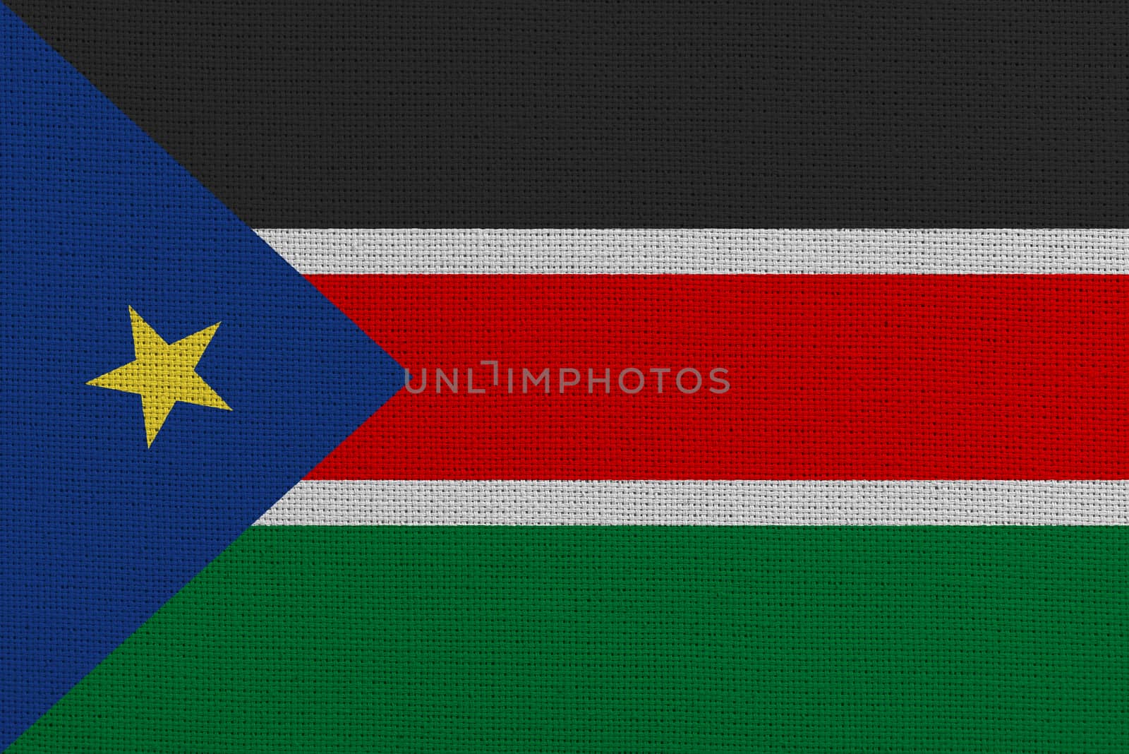 South Sudan fabric flag. Patriotic background. National flag of South Sudan