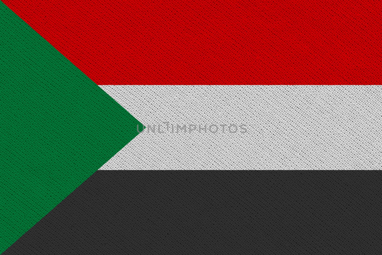 Sudan fabric flag. Patriotic background. National flag of Sudan