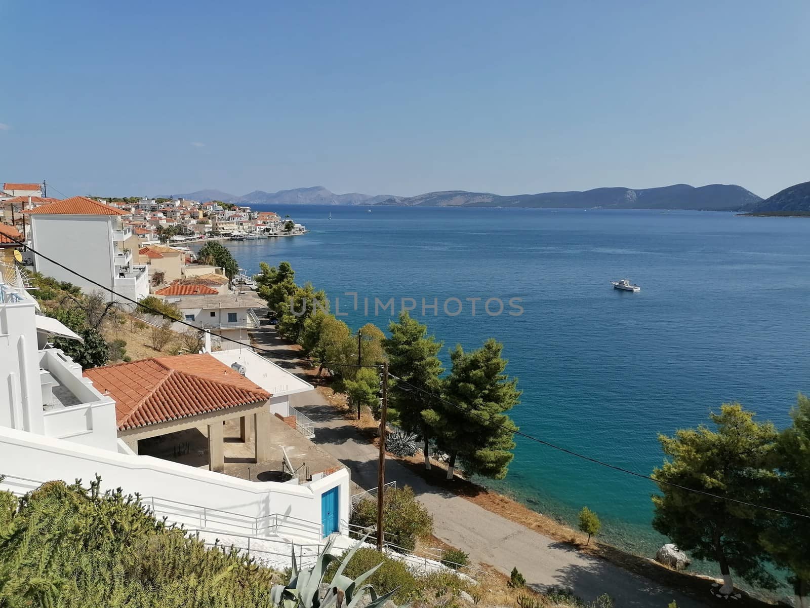 Greece white houses and blue sea and sky. Beautiful Greek peleponnese Ermioni