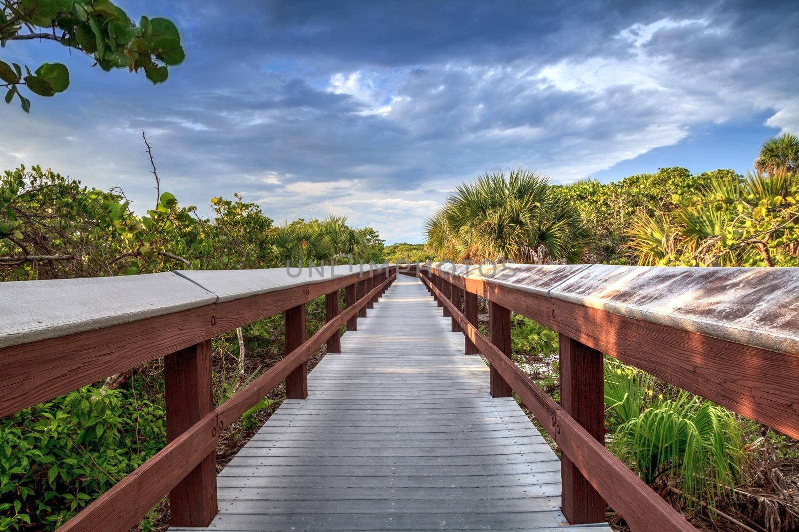 Boardwalk leads down to the white sand of Barefoot Beach in Bonita Springs, Florida