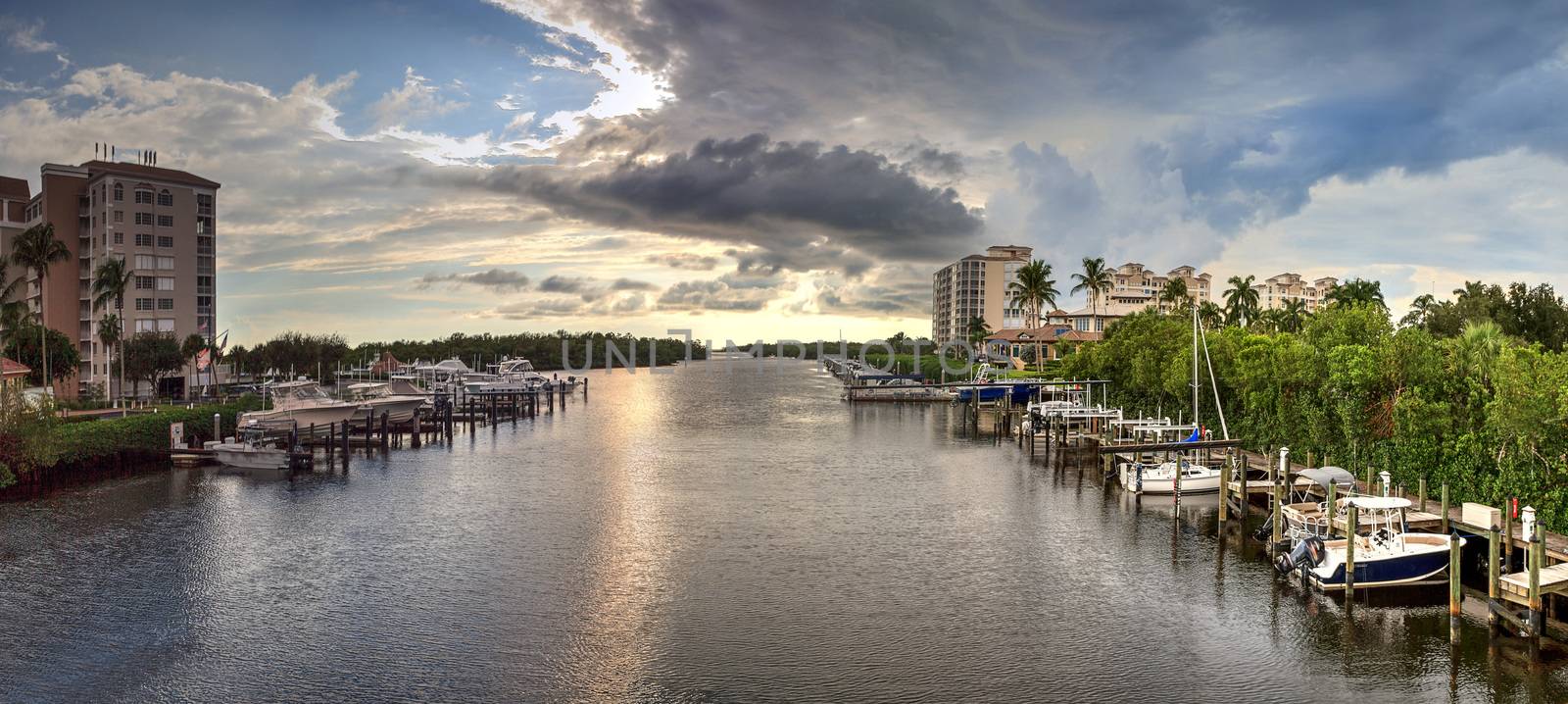 Boats docked in a harbor along the Cocohatchee River in Bonita S by steffstarr