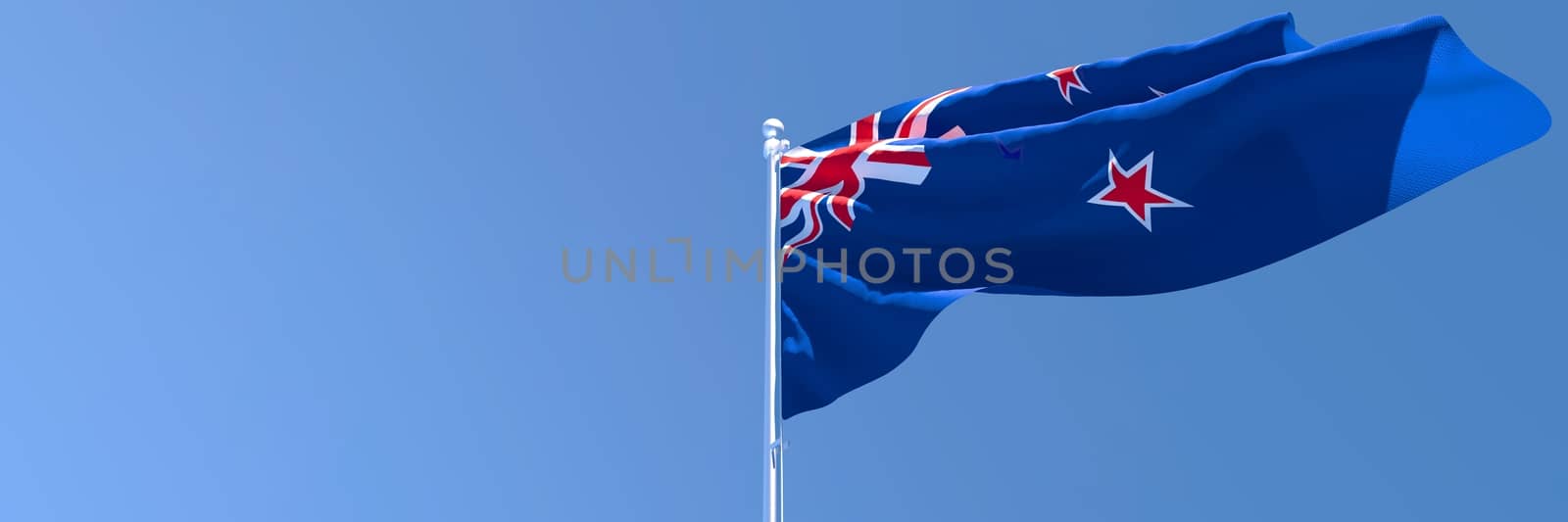 3D rendering of the national flag of New Zealand waving in the wind against a blue sky