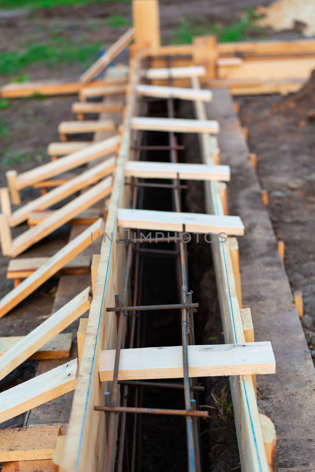 Reinforcement of corners for creating strip foundation for new house basis.