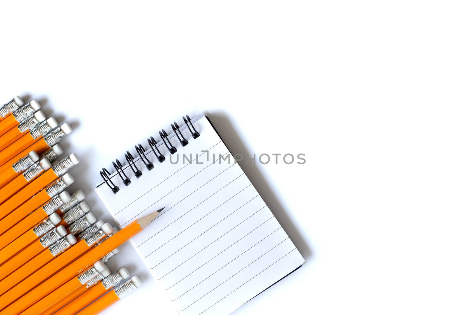 Stationery flat lay. Weekly organizer planner, sharp pencil surrounded by dull pencils. Stationery flat lay. Back to school. White background. Business, sharp idea concept