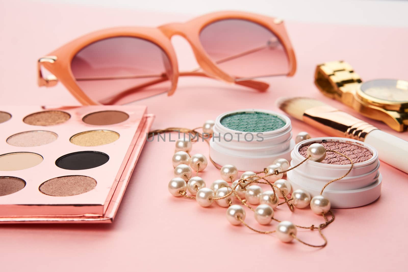 eyeshadow makeup brushes collection professional cosmetics accessories on pink background. High quality photo